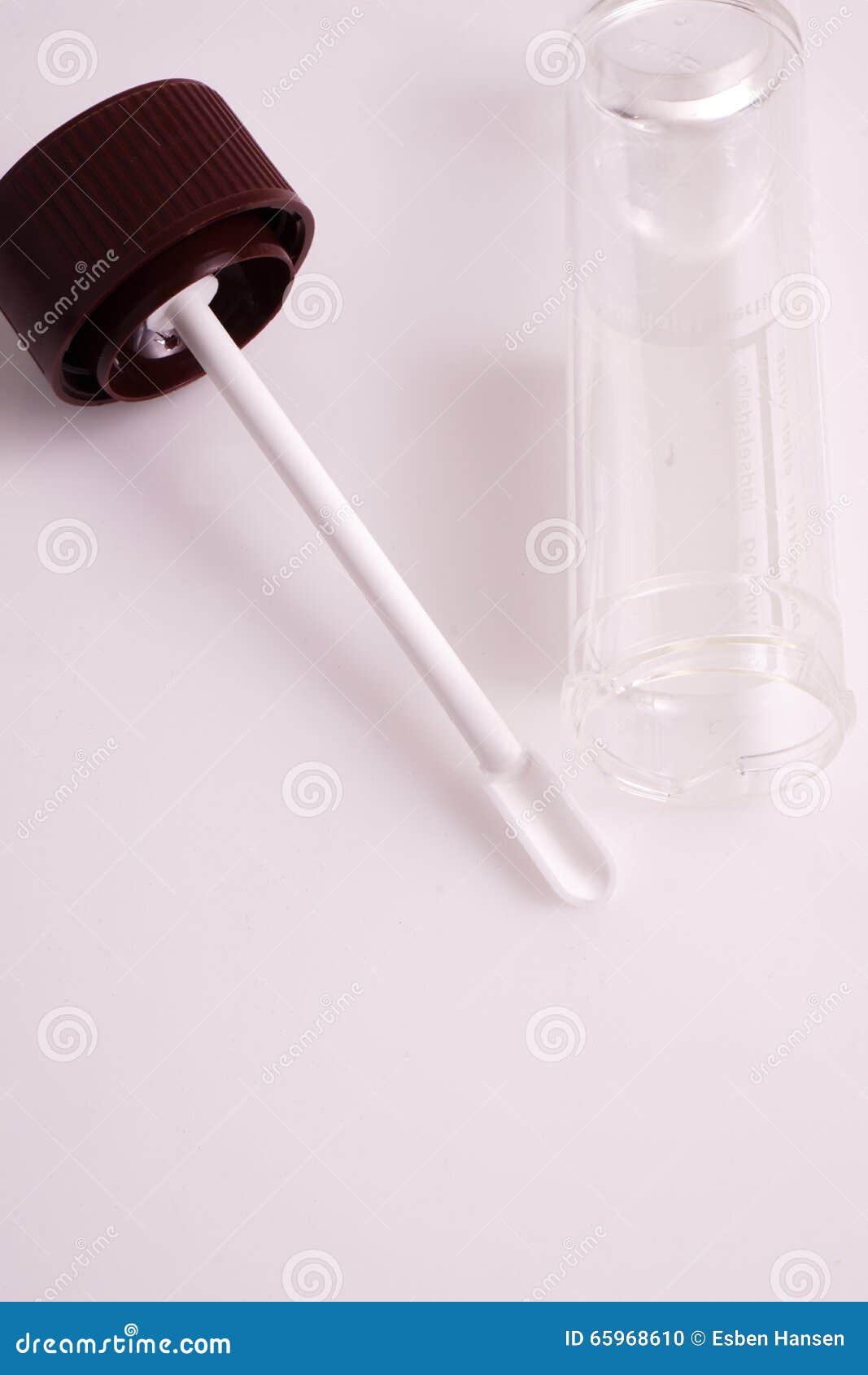 A Stool Sample Container For Fecal Tests In The Bathroom With A Roll Of Toilet Paper On The