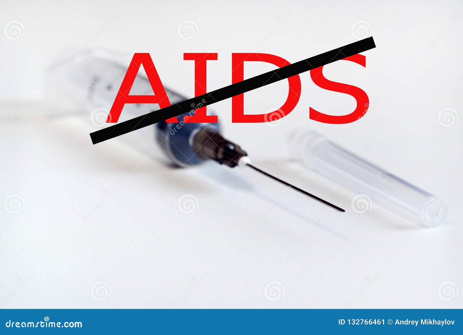 stop aids. no drugs. syringe with needle on light background. the needle in the protective cap