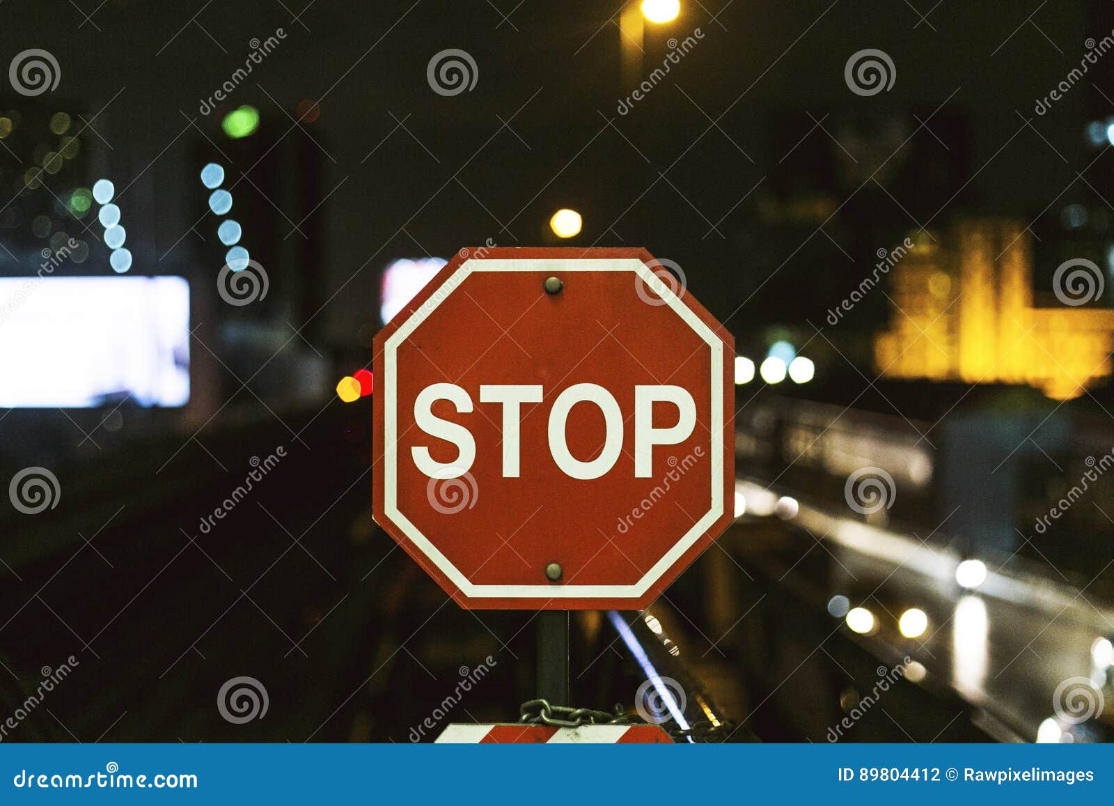 Stop Sign in the Middle of City Traffic Stock Photo - Image of blurry