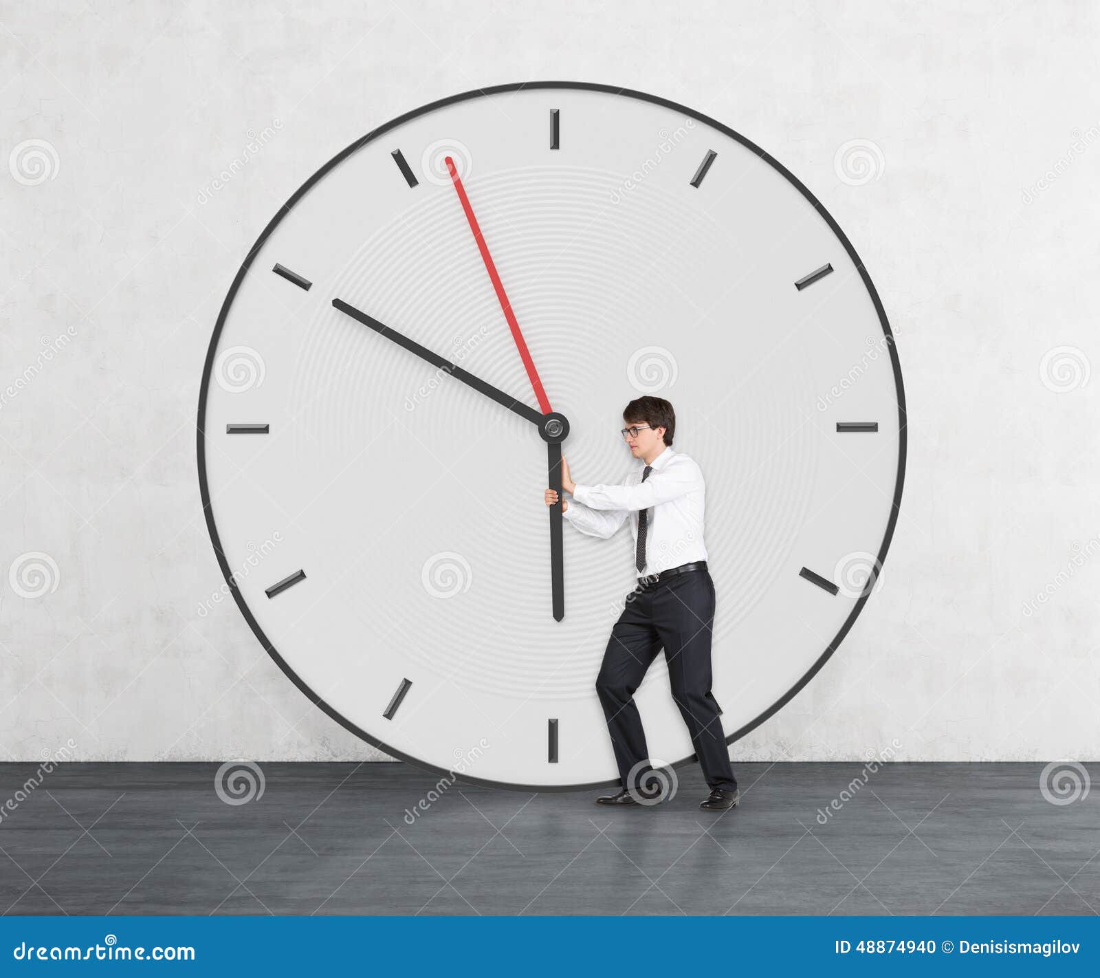 Businessman trying to stop time Stock Photo by ©kantver 69891211