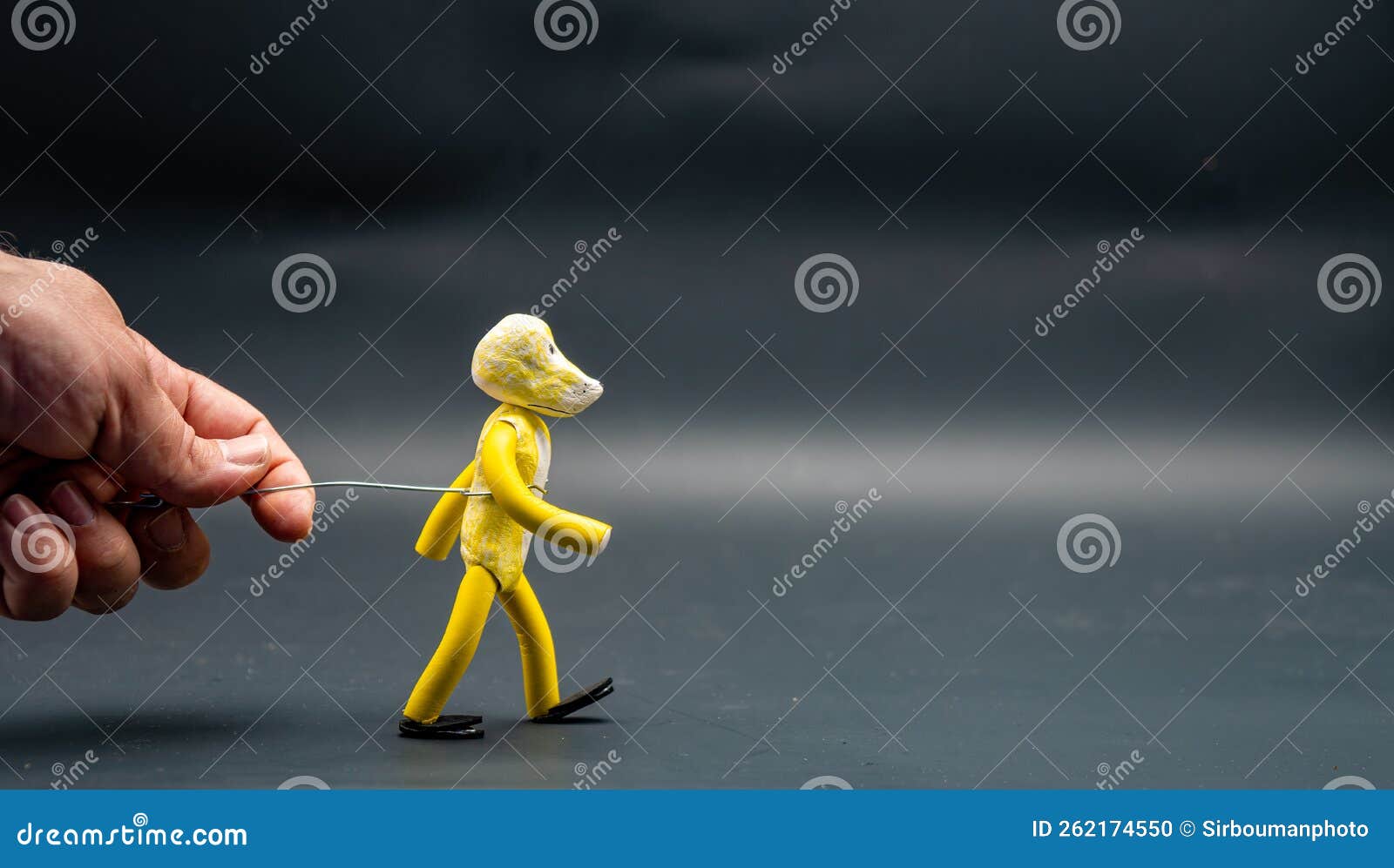 stopmotion process of walking. man's hand holding with an aluminum wire a figure