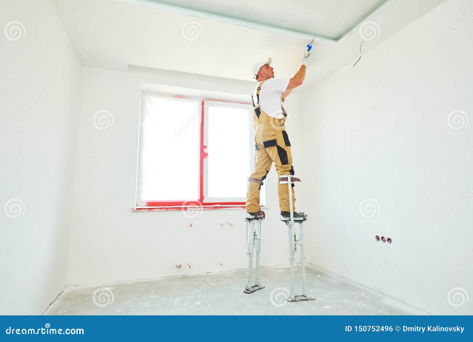 Painter In Stilts With Putty Knife Plasterer Smoothing