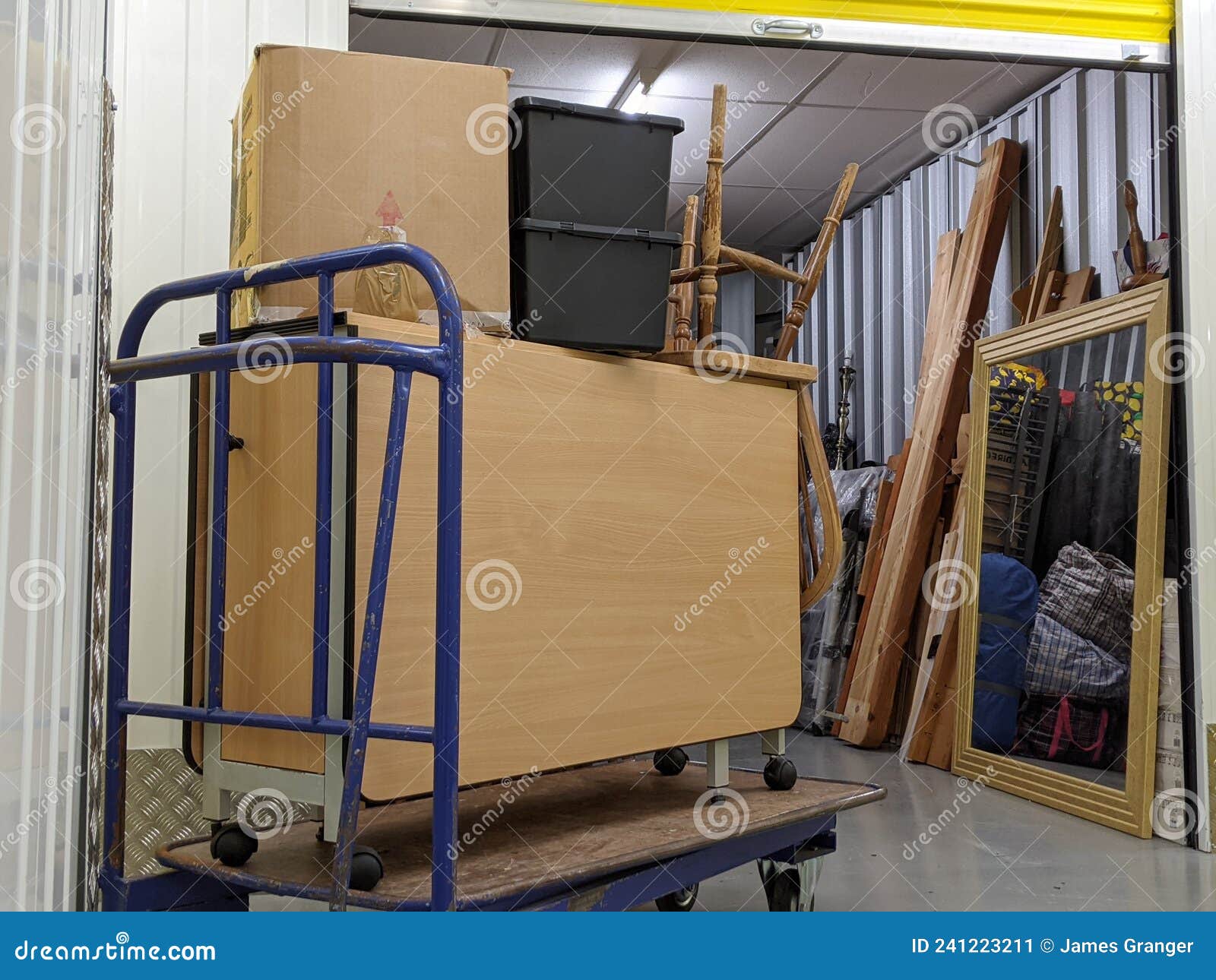 Self Storage Unit Clearance Packing Furniture into Room Stock Image