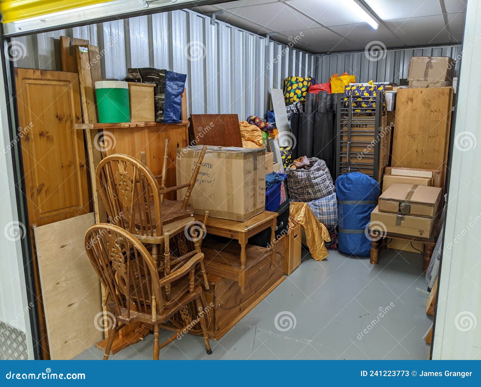self storage unit clearance packing furniture into room