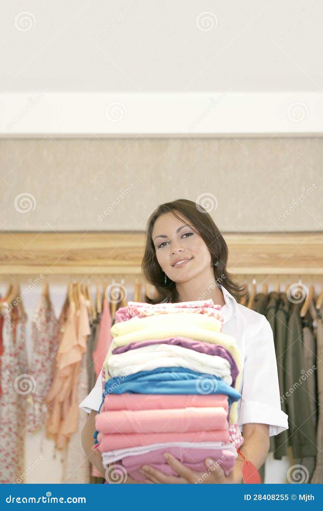 Store Attendant Holding Pile of Clothes Stock Image Image of
