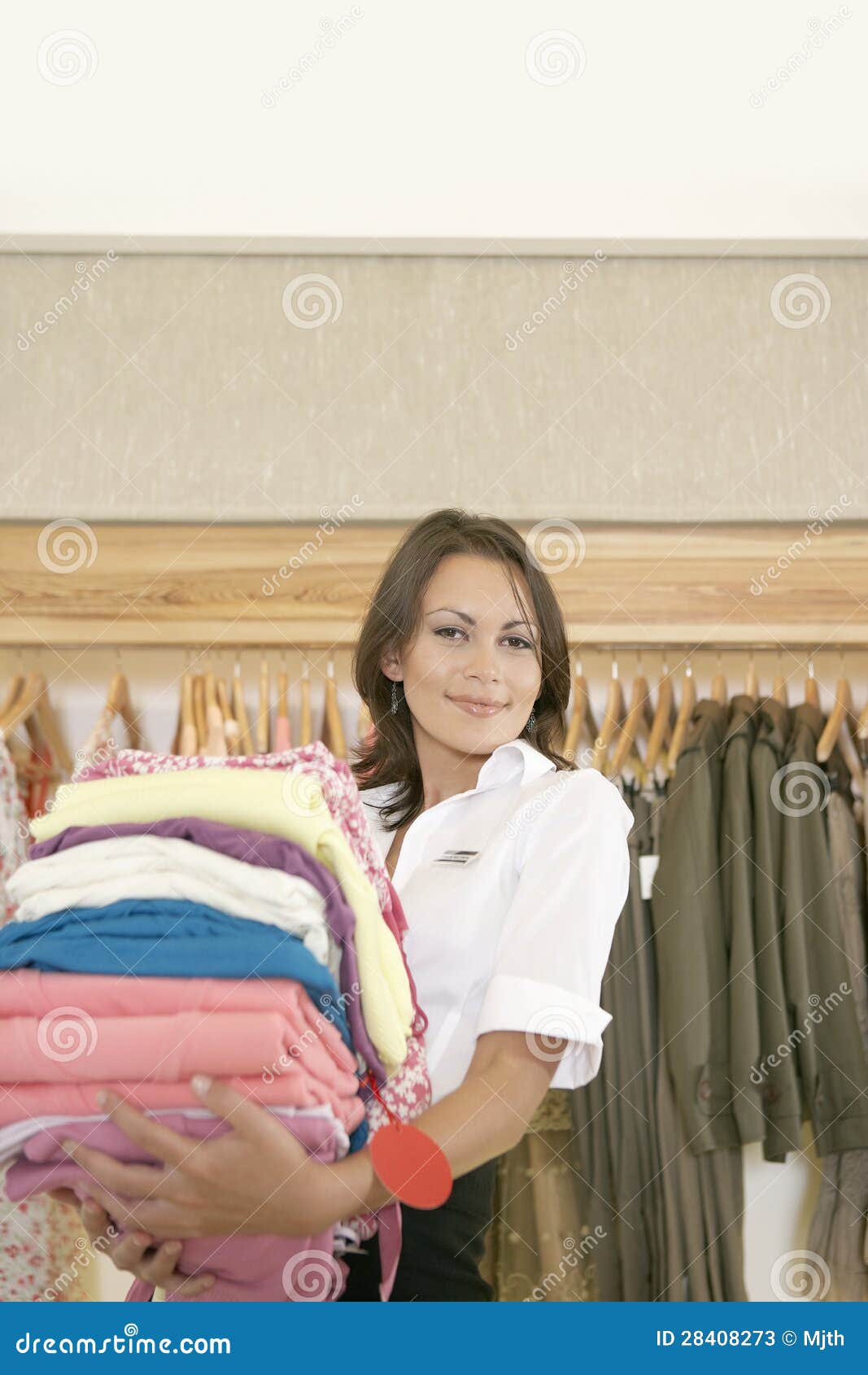 Store Attendant Holding Pile of Clothes Stock Image Image of