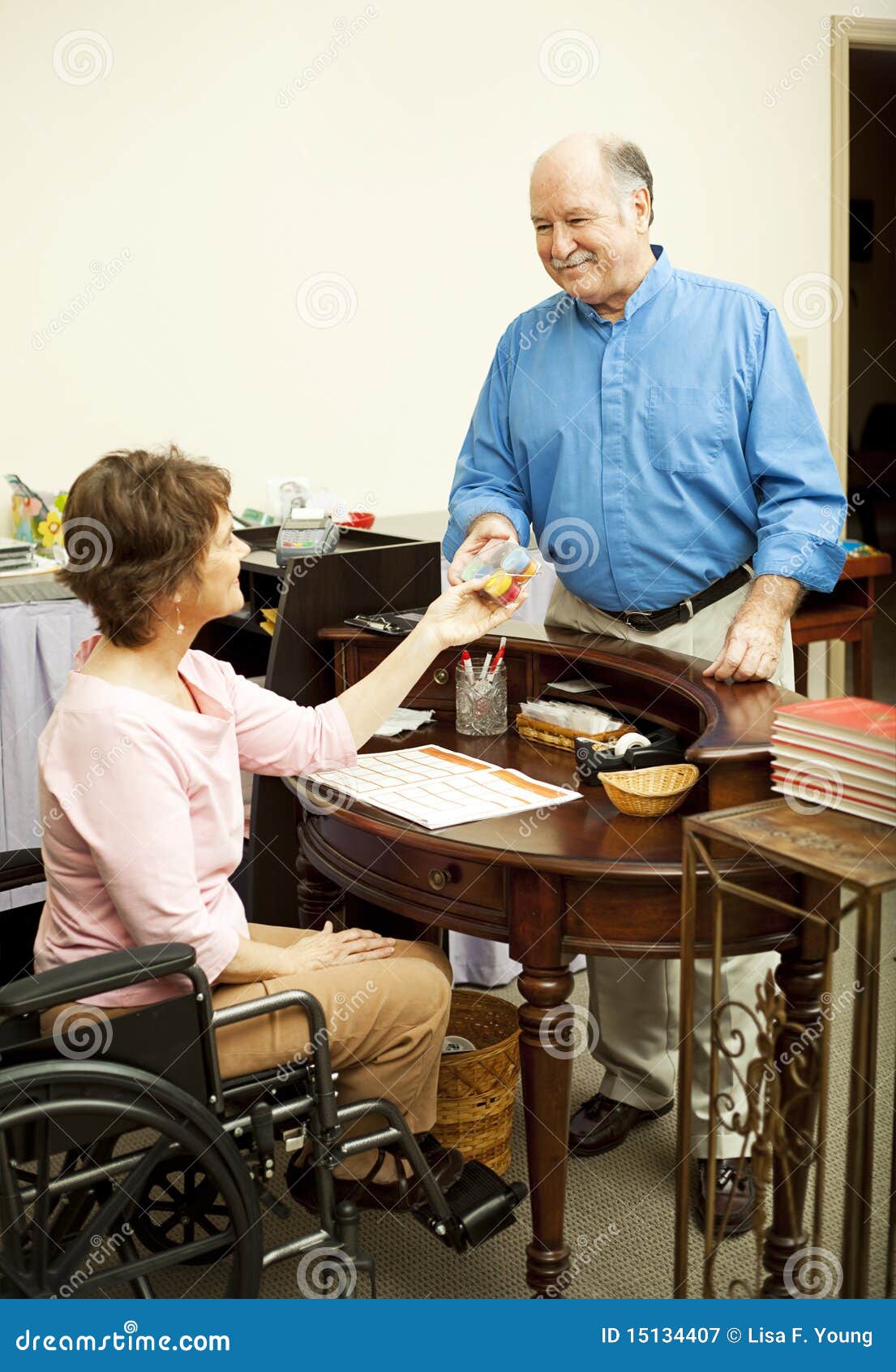 store clerk in wheelchair