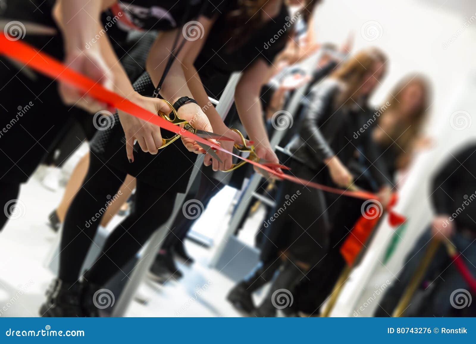 store grand opening - cutting red ribbon