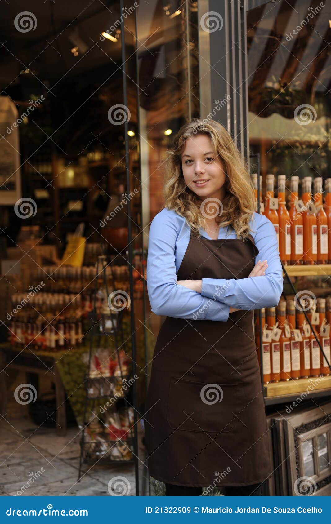 store owner in front of shop