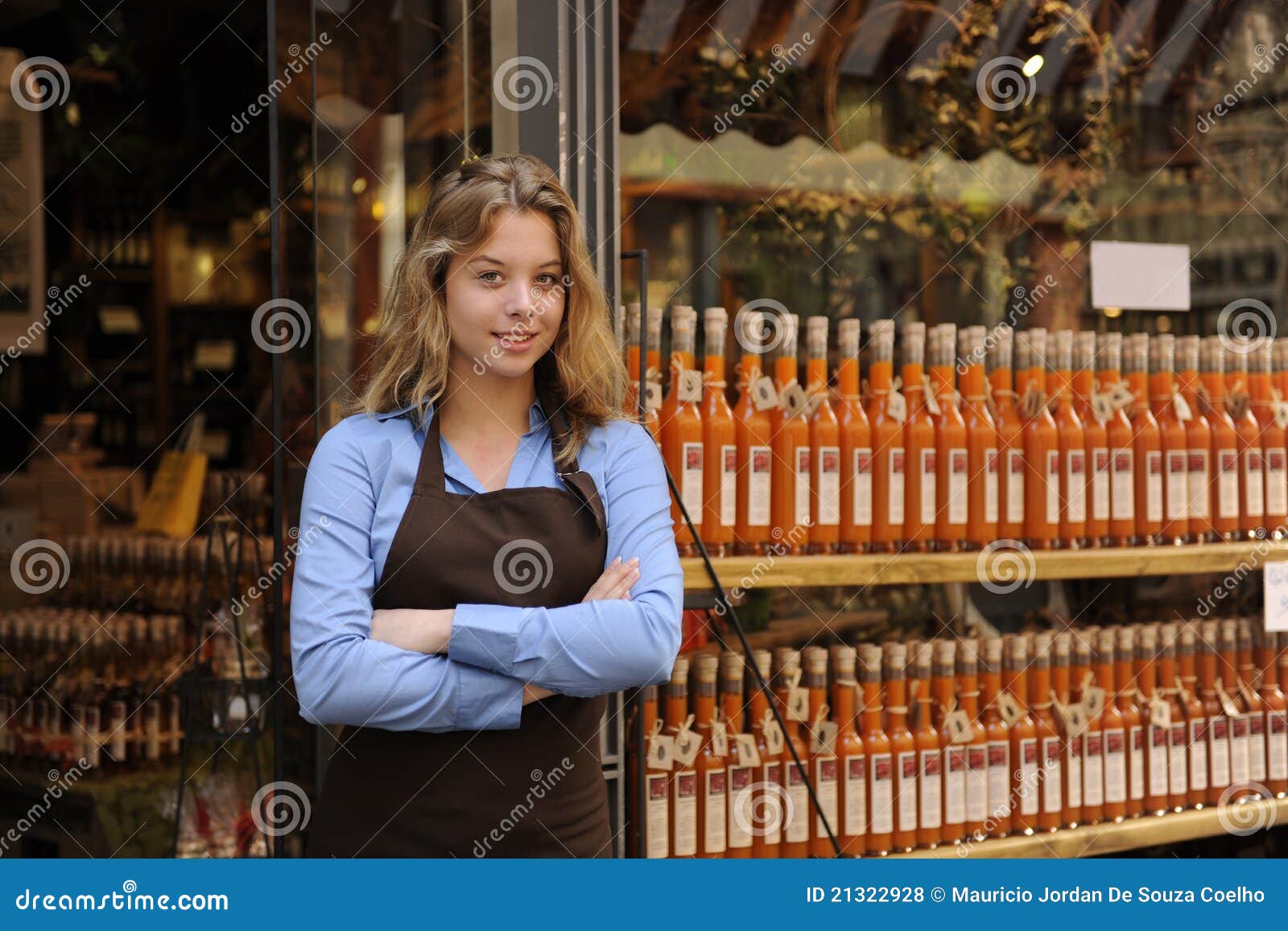 store owner in front of shop