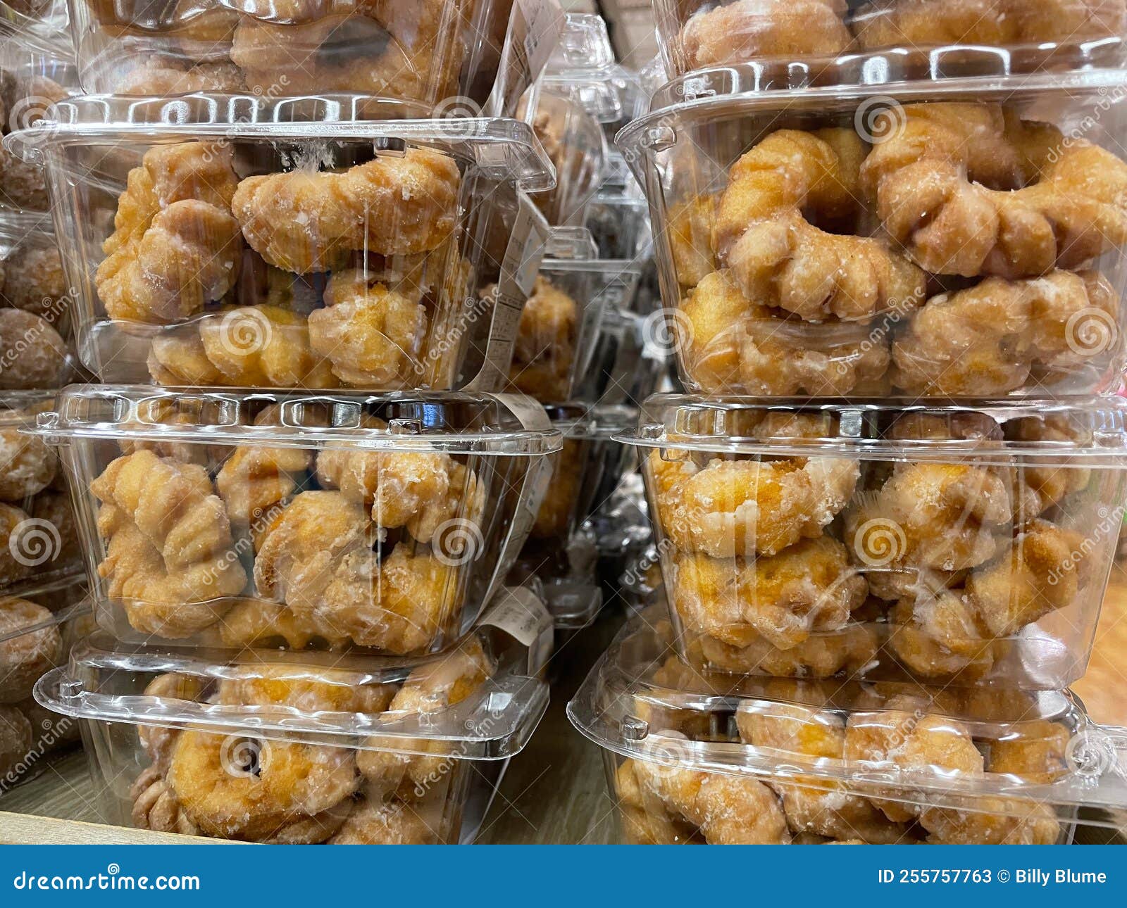 Store Packaged Donuts Stacked Up on Display Stock Image Image of sale