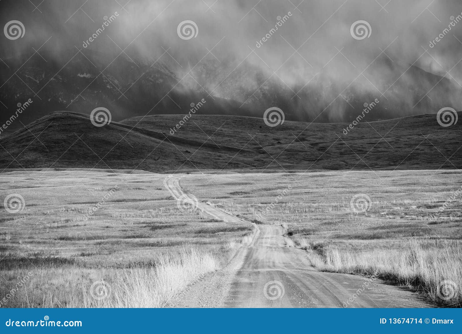 storm cloud passing through a barren mountain land