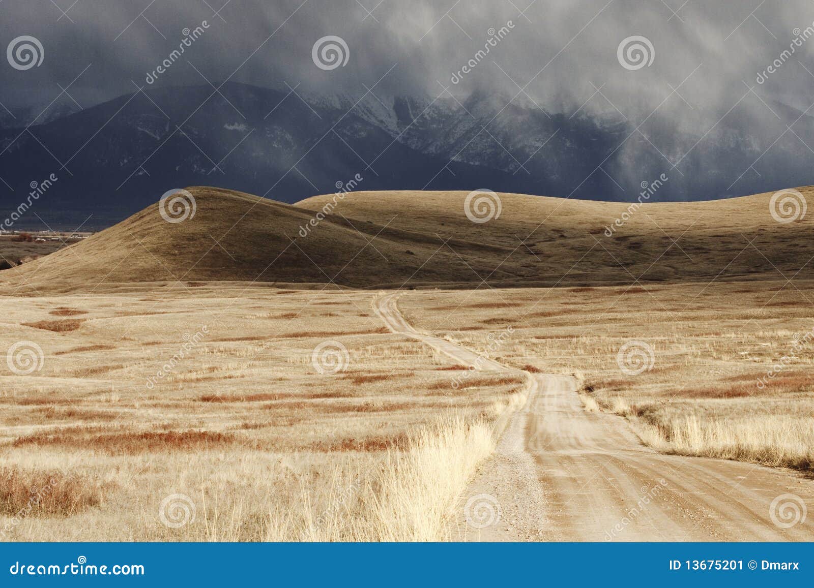 storm cloud passing through a barren mountain land