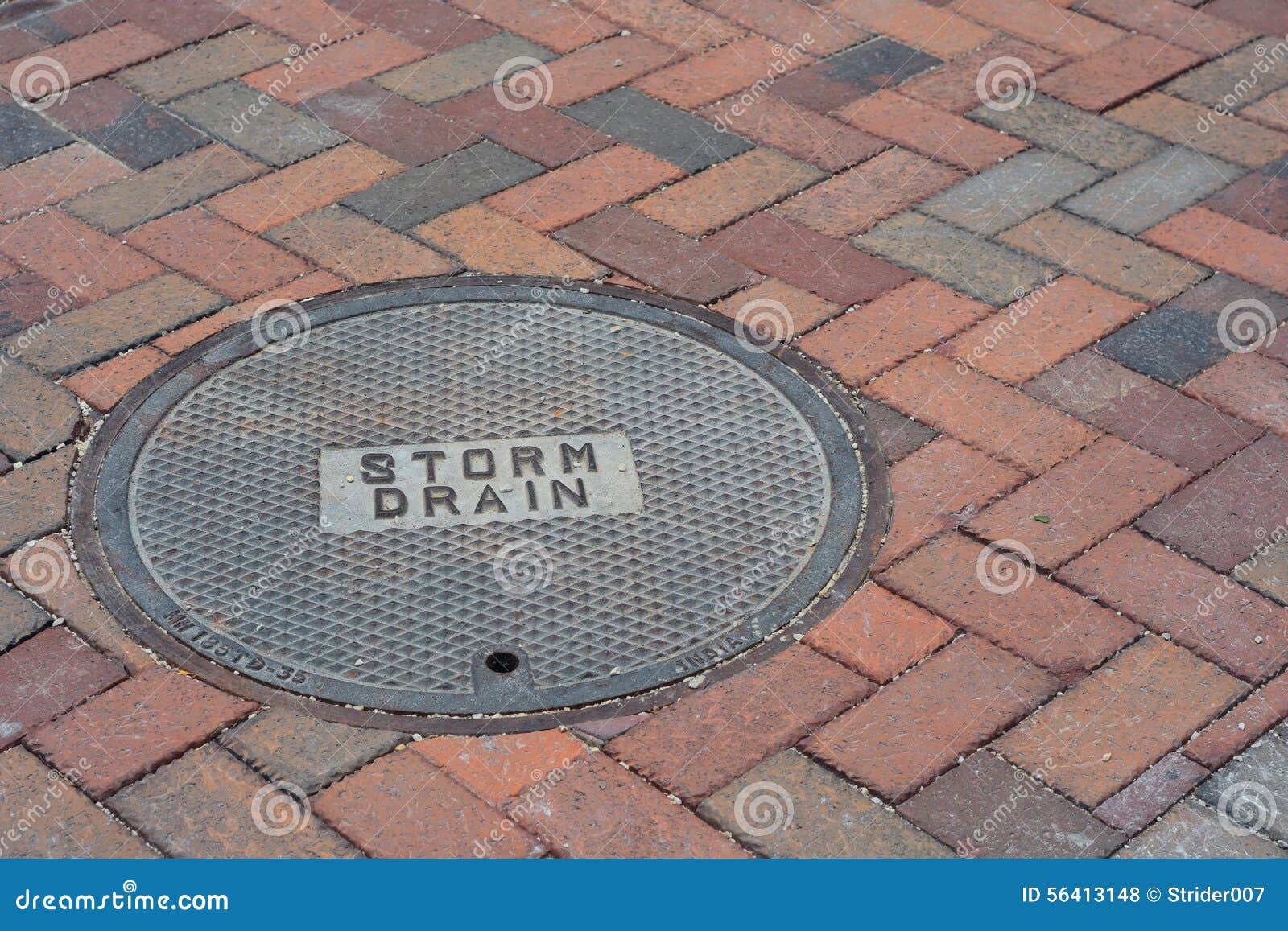 Storm Drain Cover on a Brick Road Stock Photo Image of blocks, ground