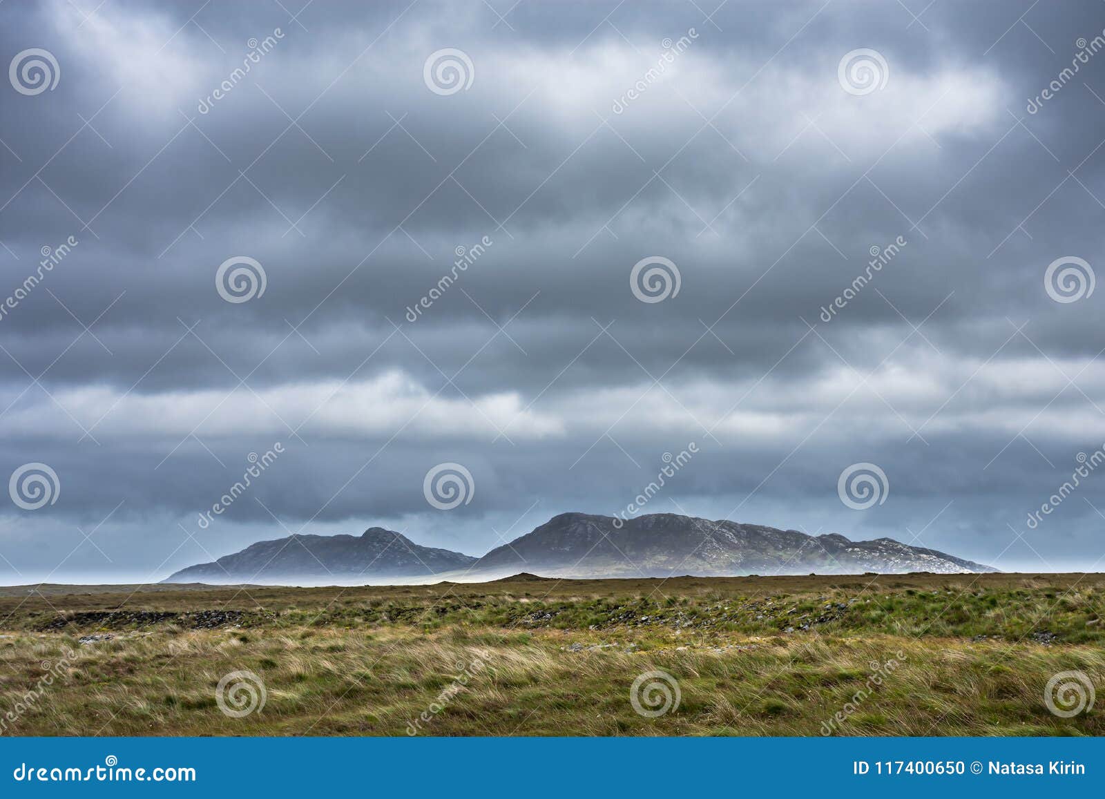 stormy sky above moorland and lee mountains. isle of north uist, outer hebrides, scotland