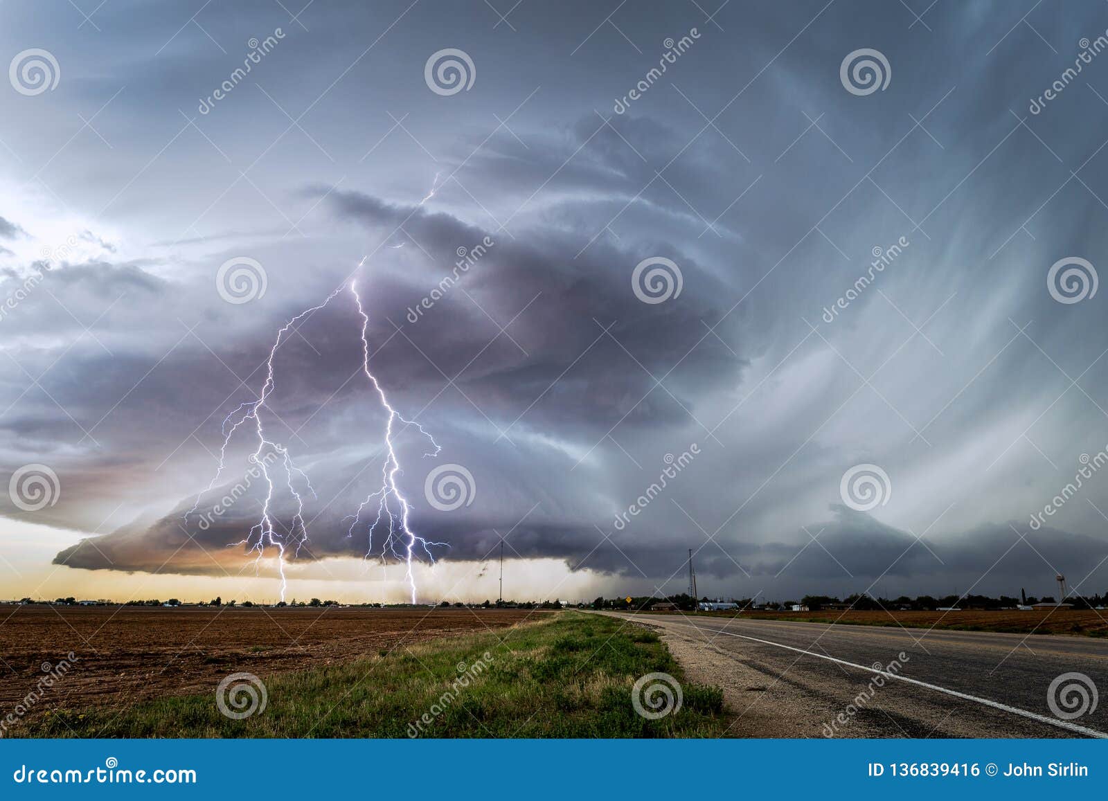 stormy sky with supercell thunderstorm and lightning bolts