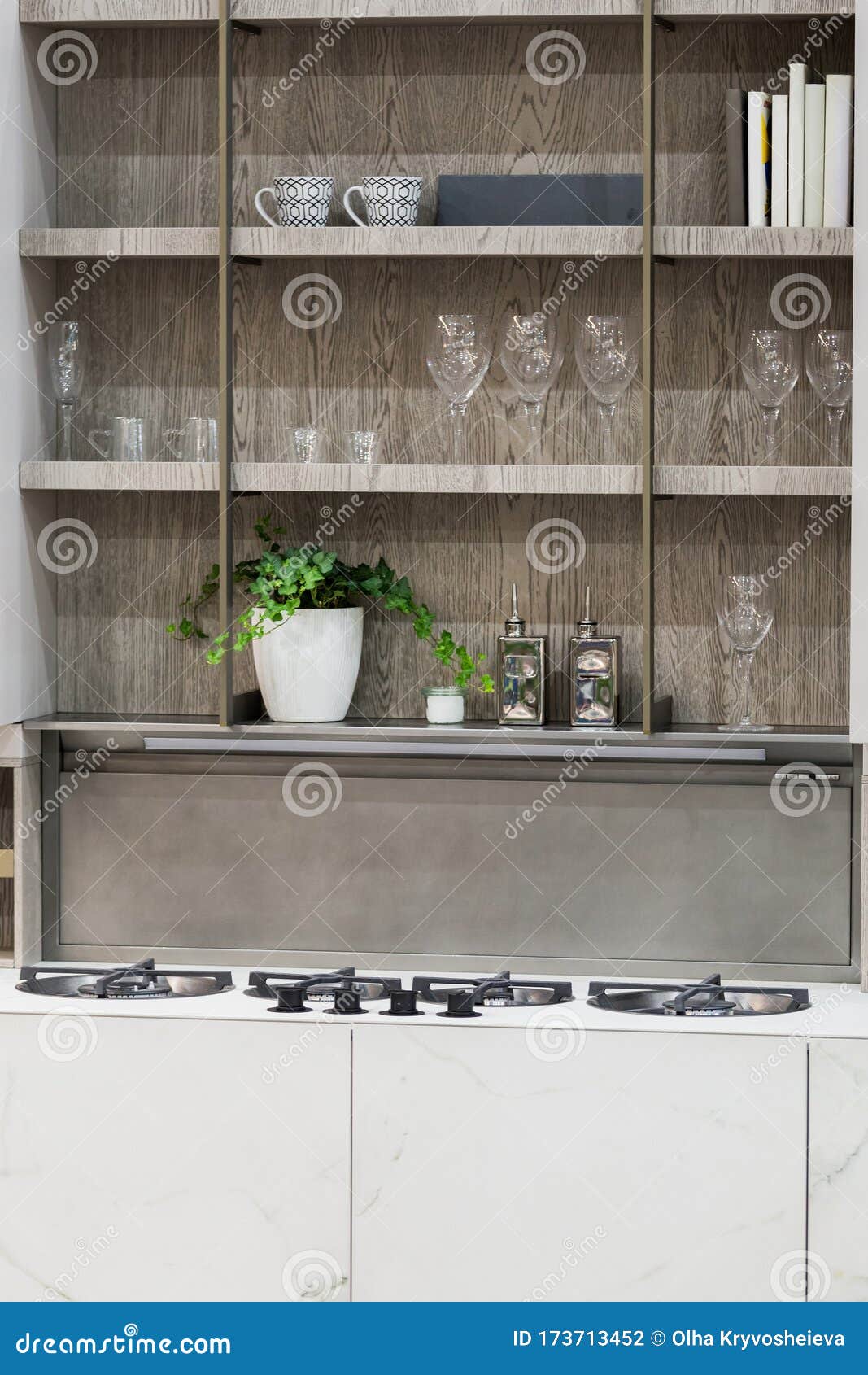Stove Closeup In Modern Kitchen Interior Gas Burners Built Into The Countertop Hanging Glass Shelves With Glasses Stock Photo Image Of Design