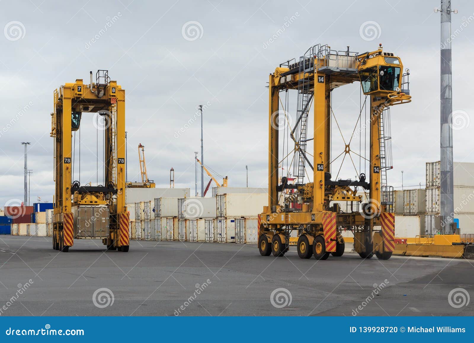 straddle carriers in a busy port