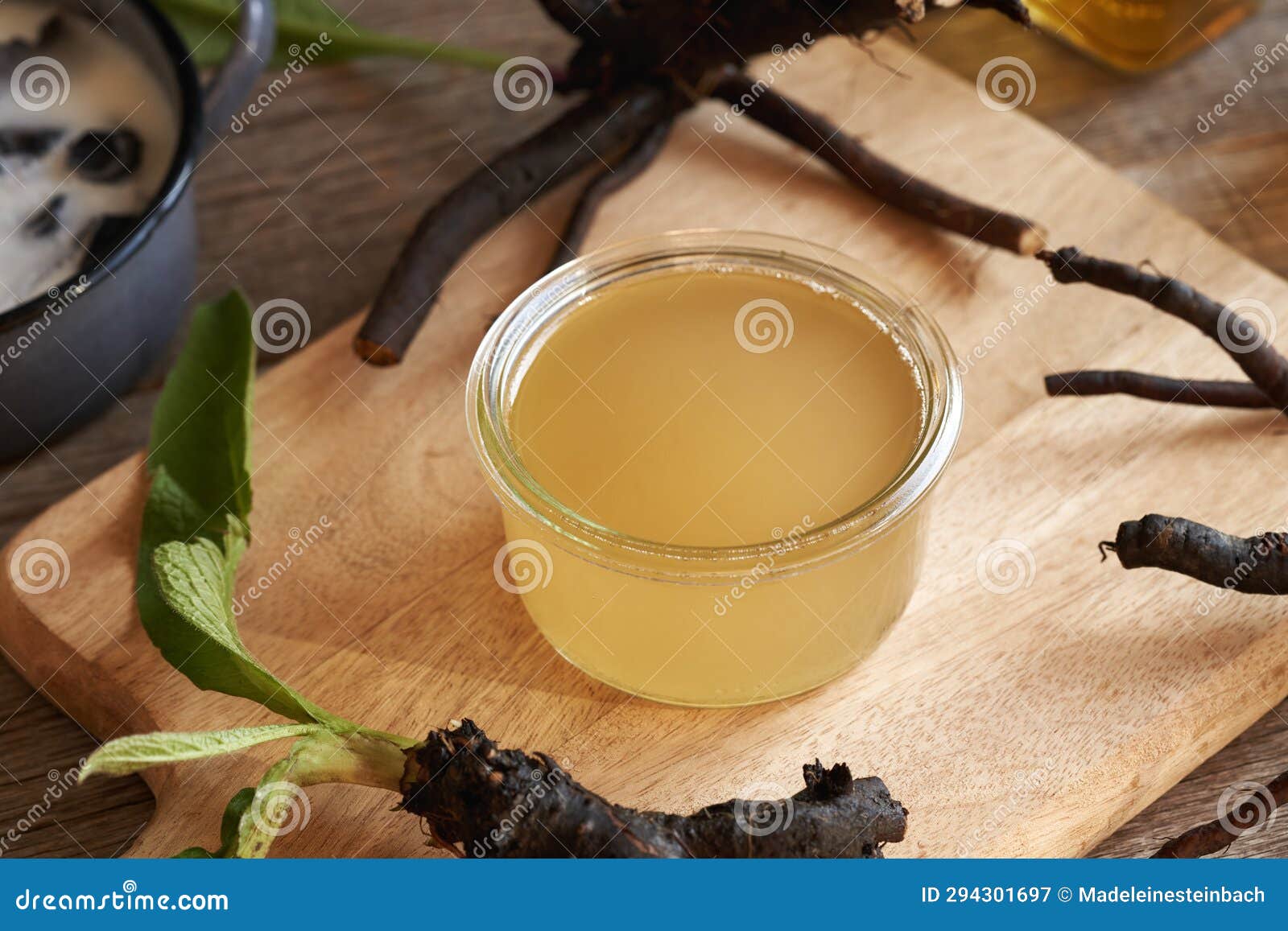 Strained Rendered Pork Lard in Which Fresh Comfrey Root Has Been