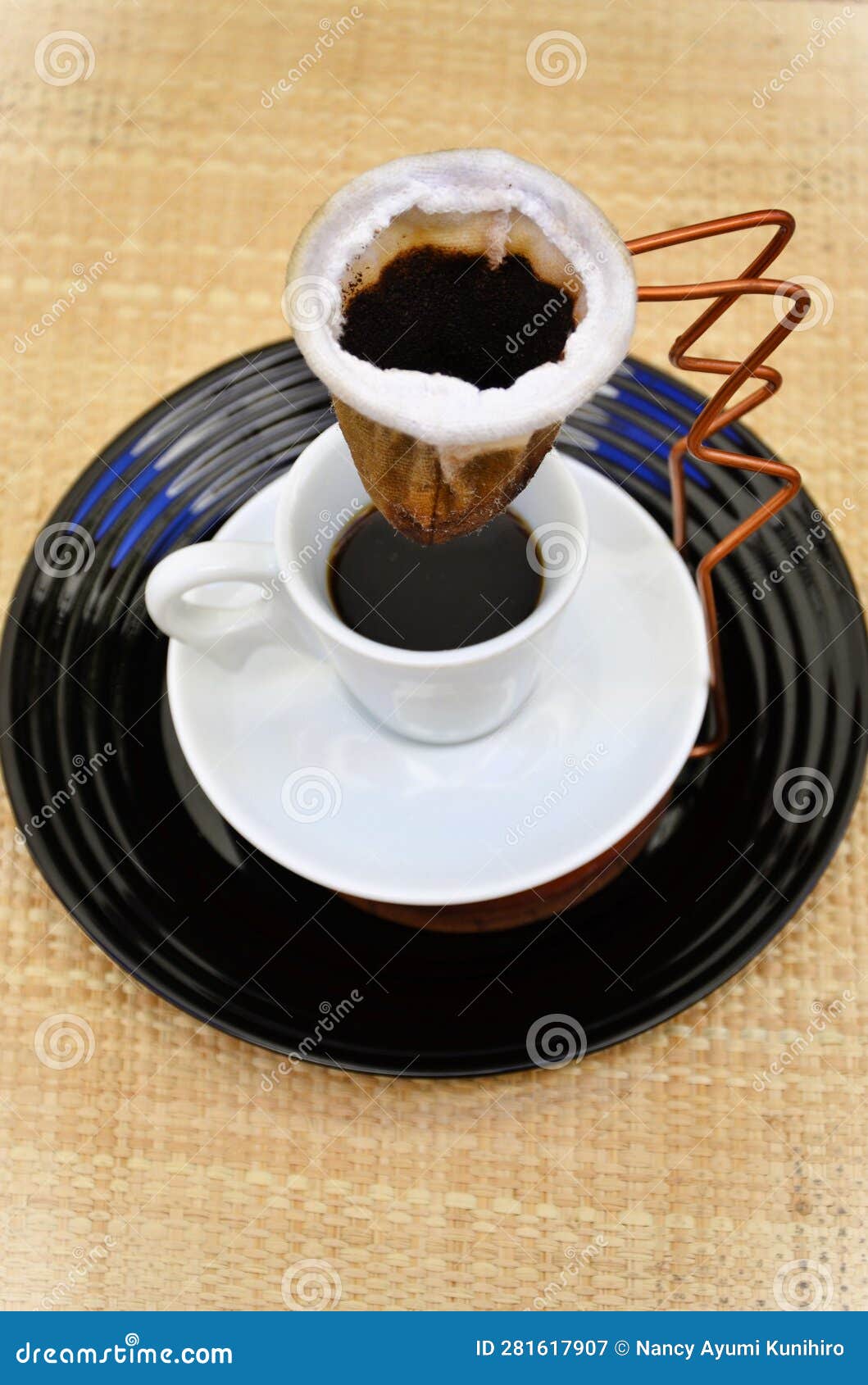 Straining the Coffee in the Individual Cloth Strainer Stock Image