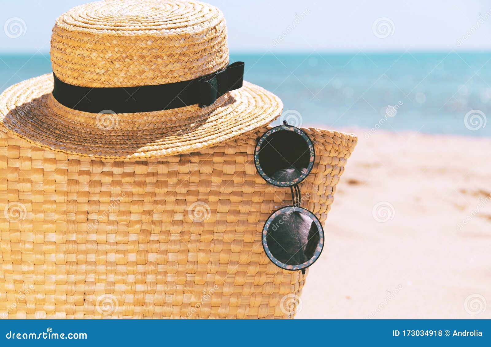Straw Bag, Straw Hat, And Sunglasses With Sea Beach At Sunset Light As ...