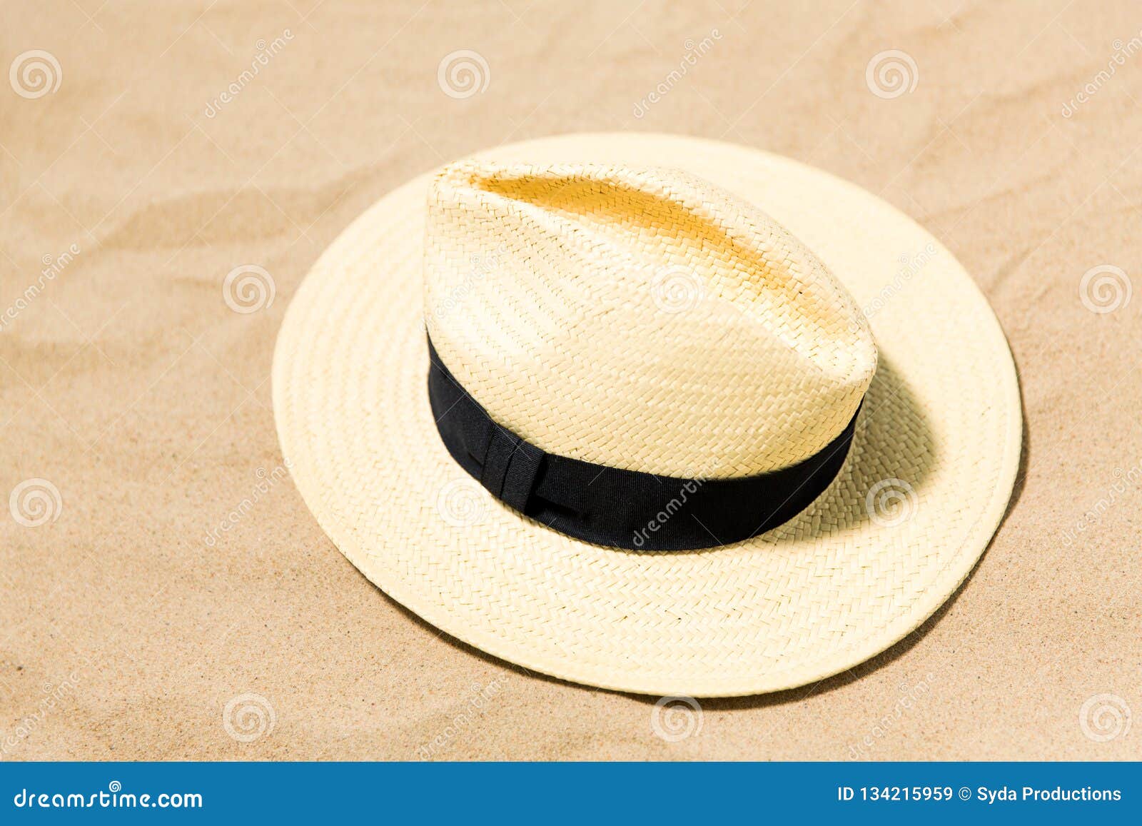 Straw hat on beach sand stock image. Image of stuff - 134215959