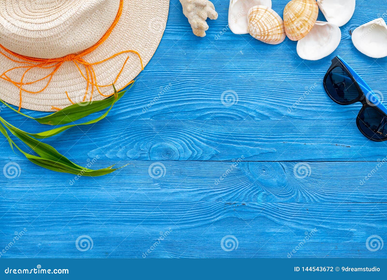 Download Straw Hat, Sun Glasses, Shells And Plant Leaves For Sea Vacation On Blue Wooden Background Top ...