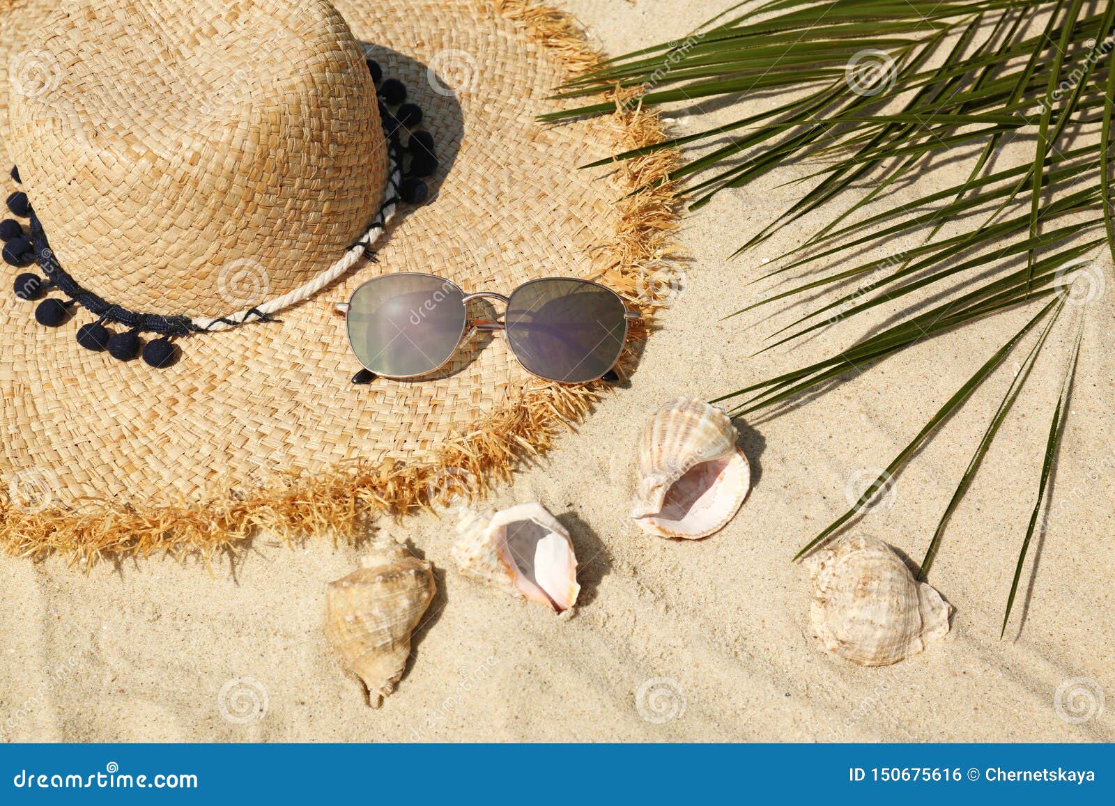 Straw Hat and Sunglasses on Sand. Beach Accessories Stock Photo Image