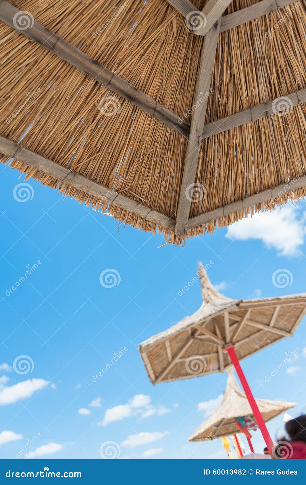 Straw parasol on the beach stock photo. Image of straw 60013982