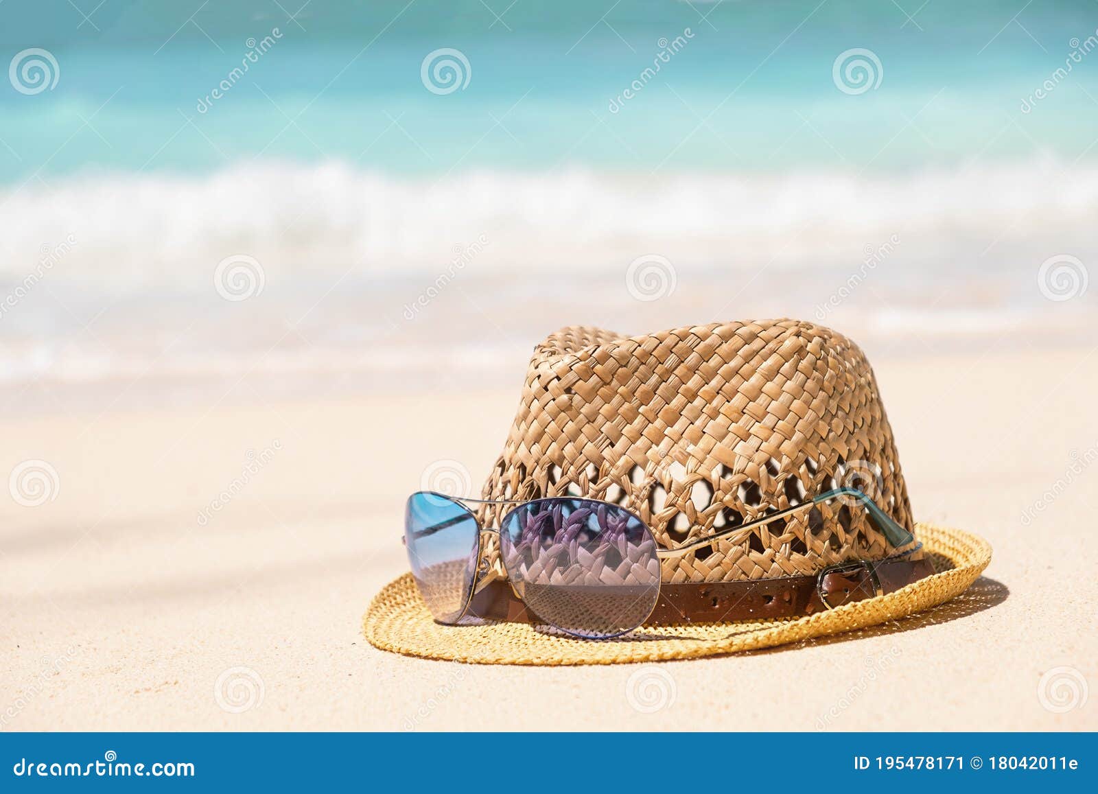 Straw Summer Hat and Blue Sunglasses on Seaside Shore with Blue Sea ...