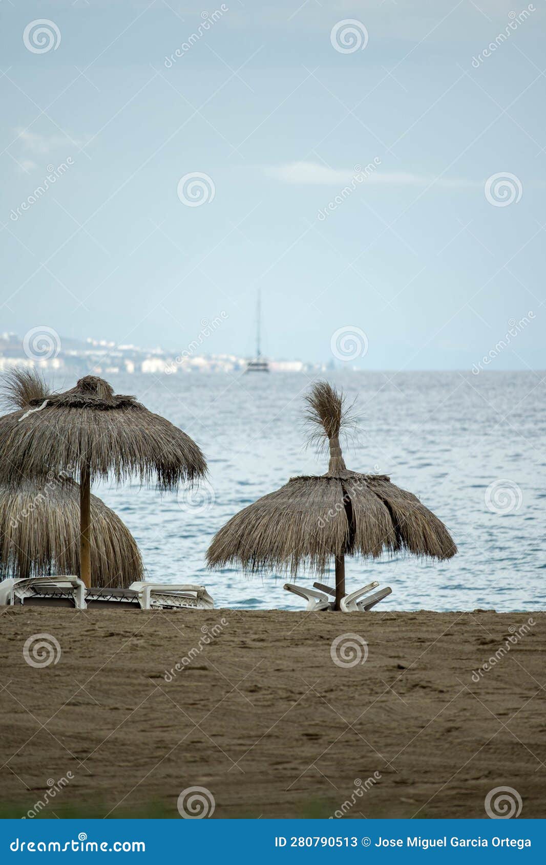 Straw Umbrellas and Hammocks on the Sand on the Beach Stock Image