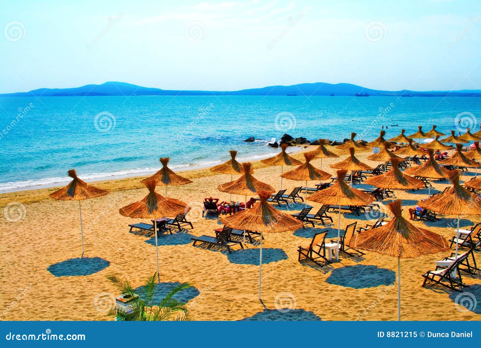 straw umbrellas on peaceful beach in bulgaria