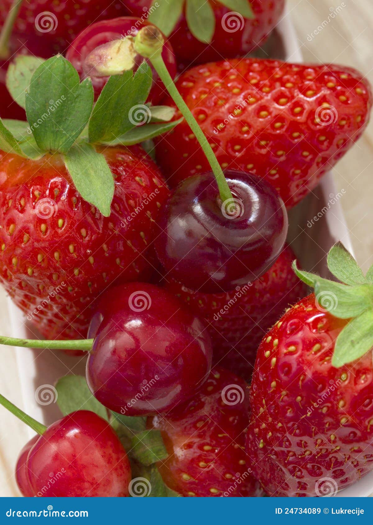 Strawberries and cherries stock image. Image of macro 24734089