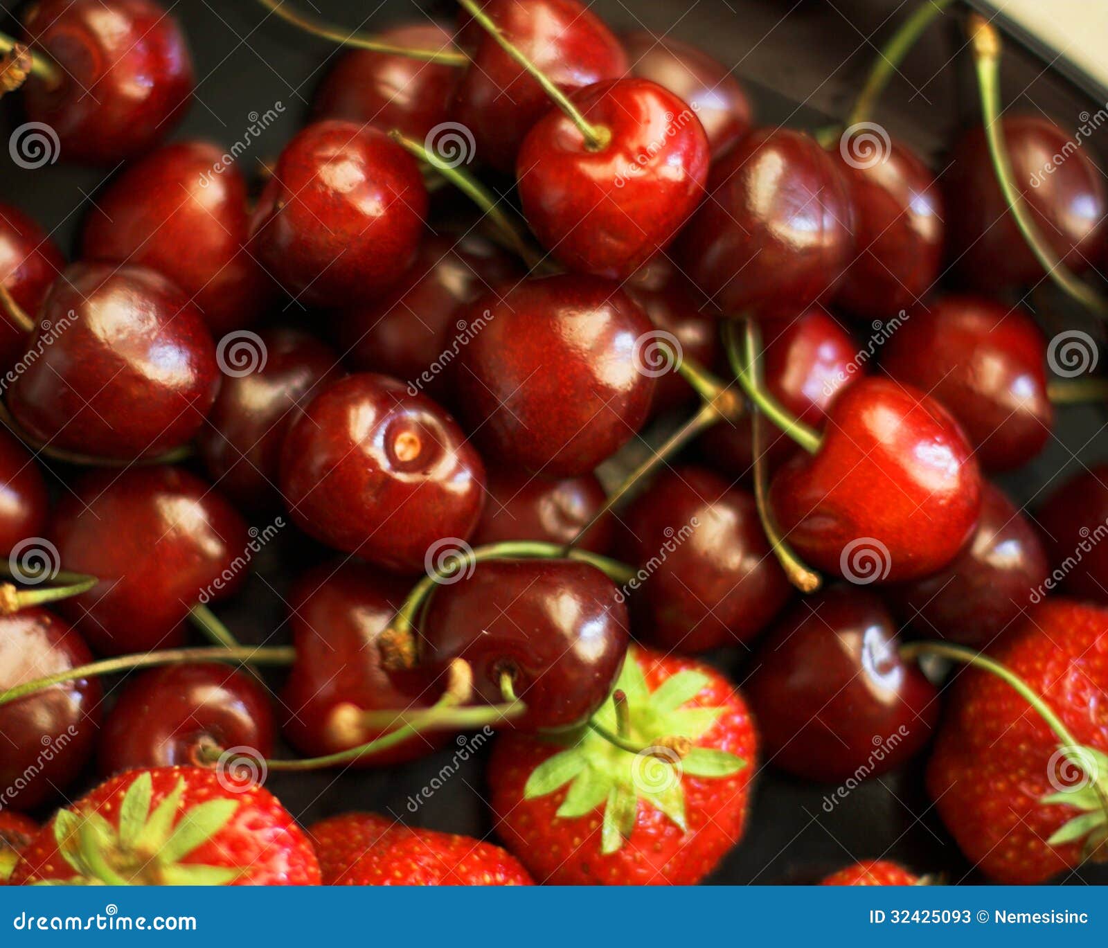 Strawberries and cherries stock image. Image of close 32425093