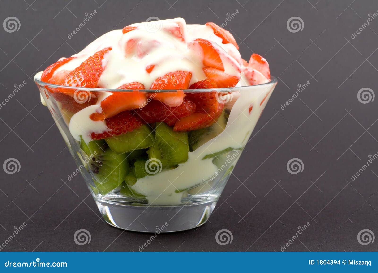Strawberries with Kiwi in Transparent Bowl with Custard Yoghurt Stock