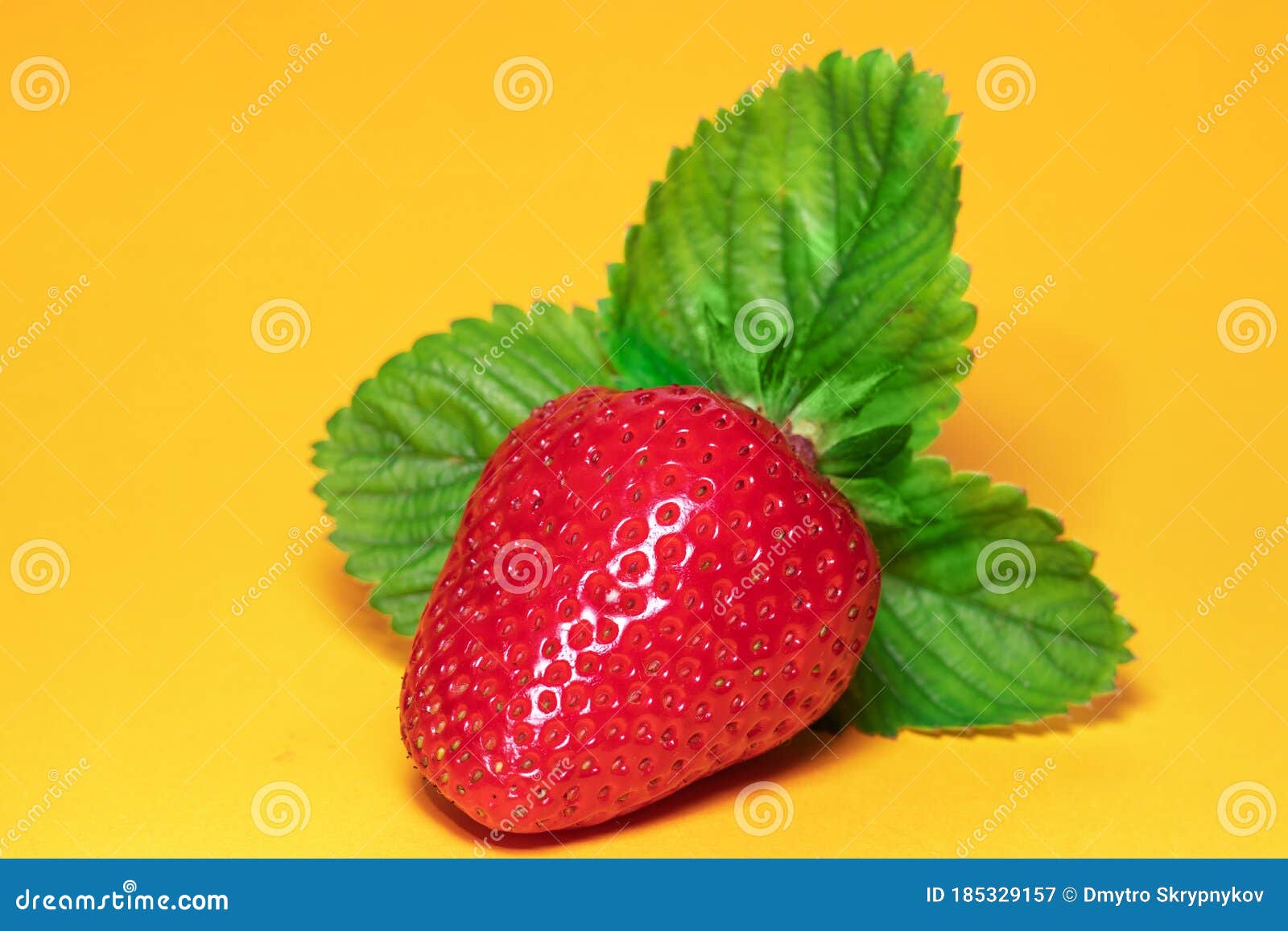 Strawberries with Leaves. on a Yellow Background Stock Image Image of