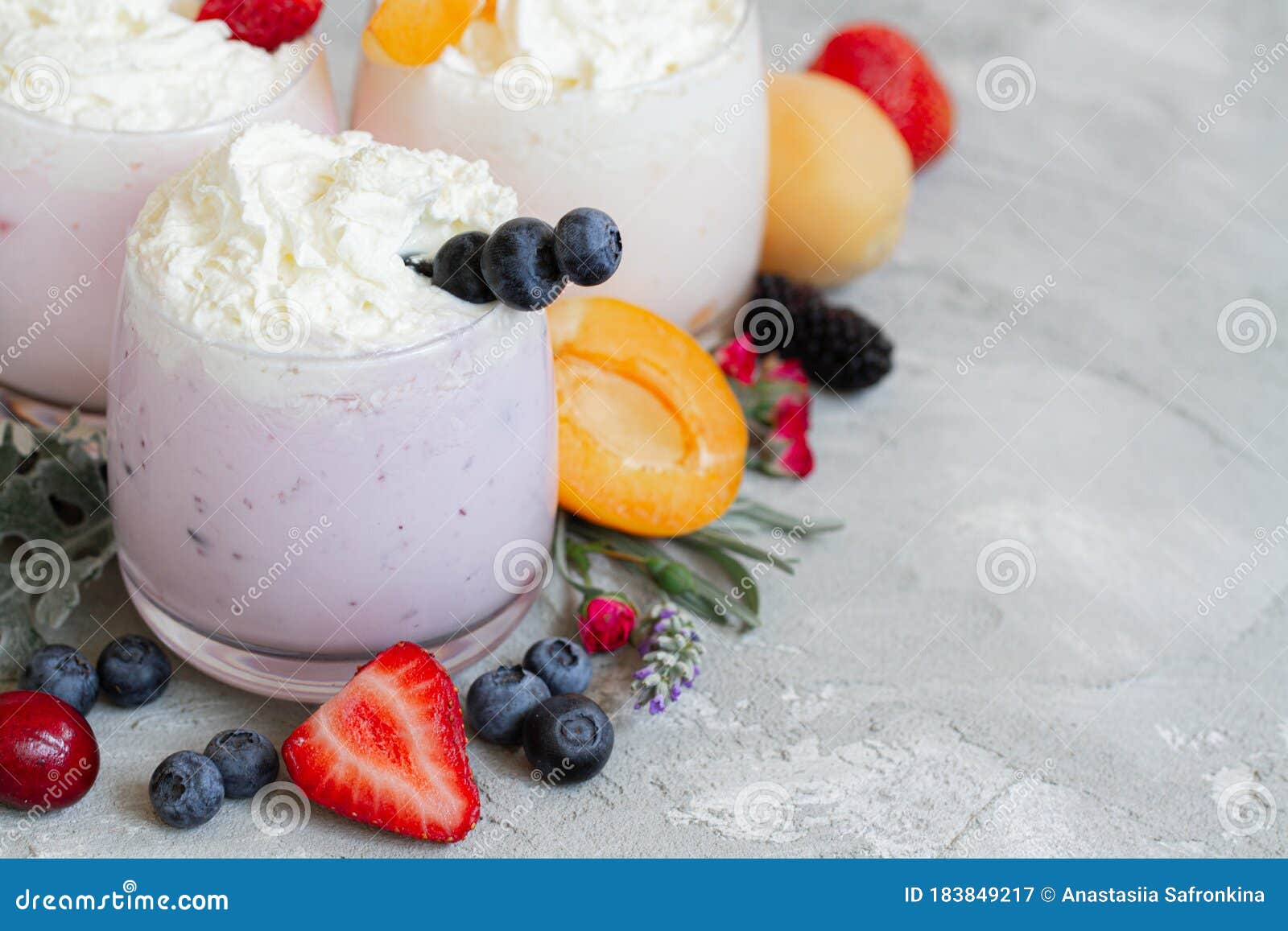 strawberry, blueberry smoothie on light background. well being and weight loos concept. milkshake with fresh berries. healthy
