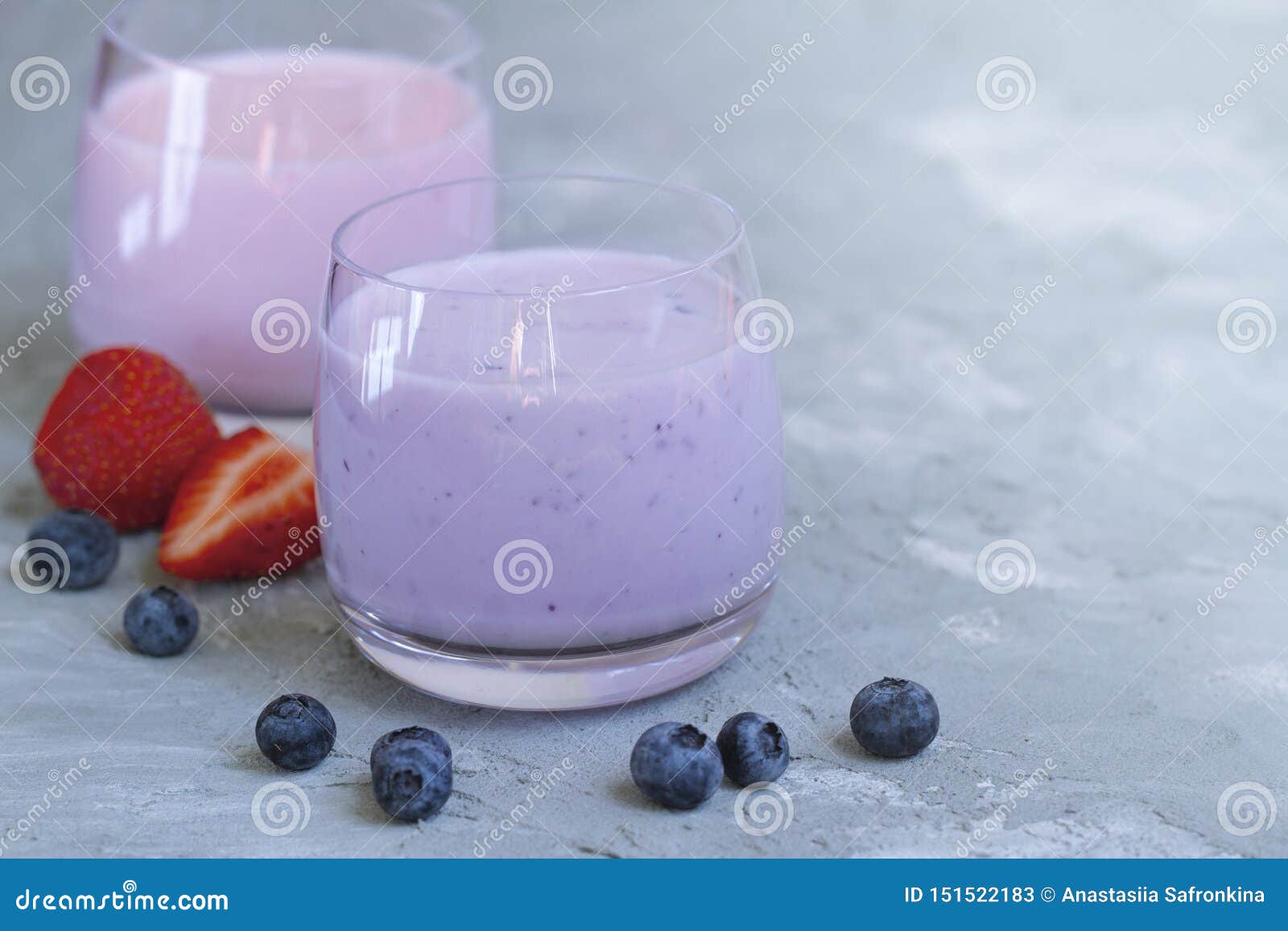 strawberry, blueberry smoothie on light background. well being and weight loos concept. milkshake with fresh berries. healthy