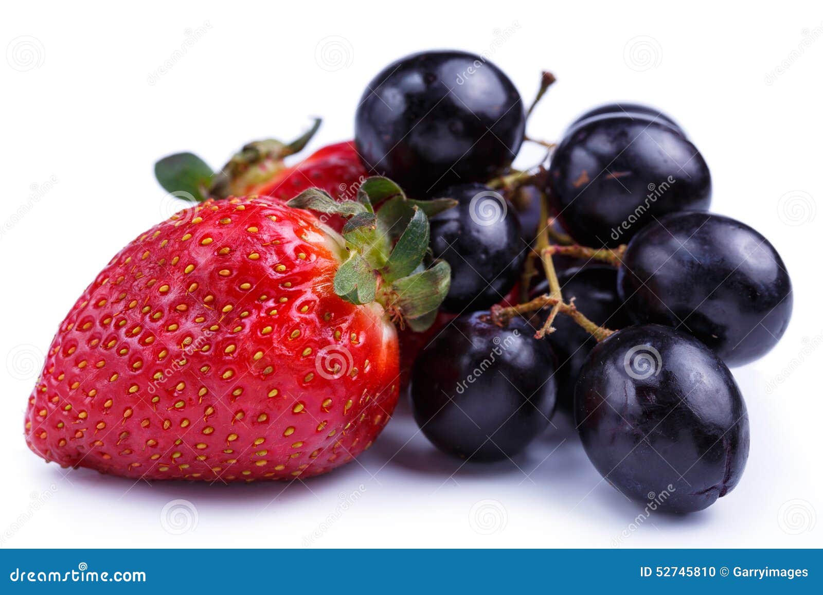 Strawberry and Grapes on a White Background. Stock Photo Image of