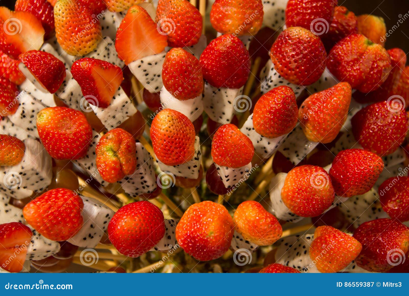 Strawberry Healthy Fruit Kebabs Made with Tropical Fruit Displa Stock
