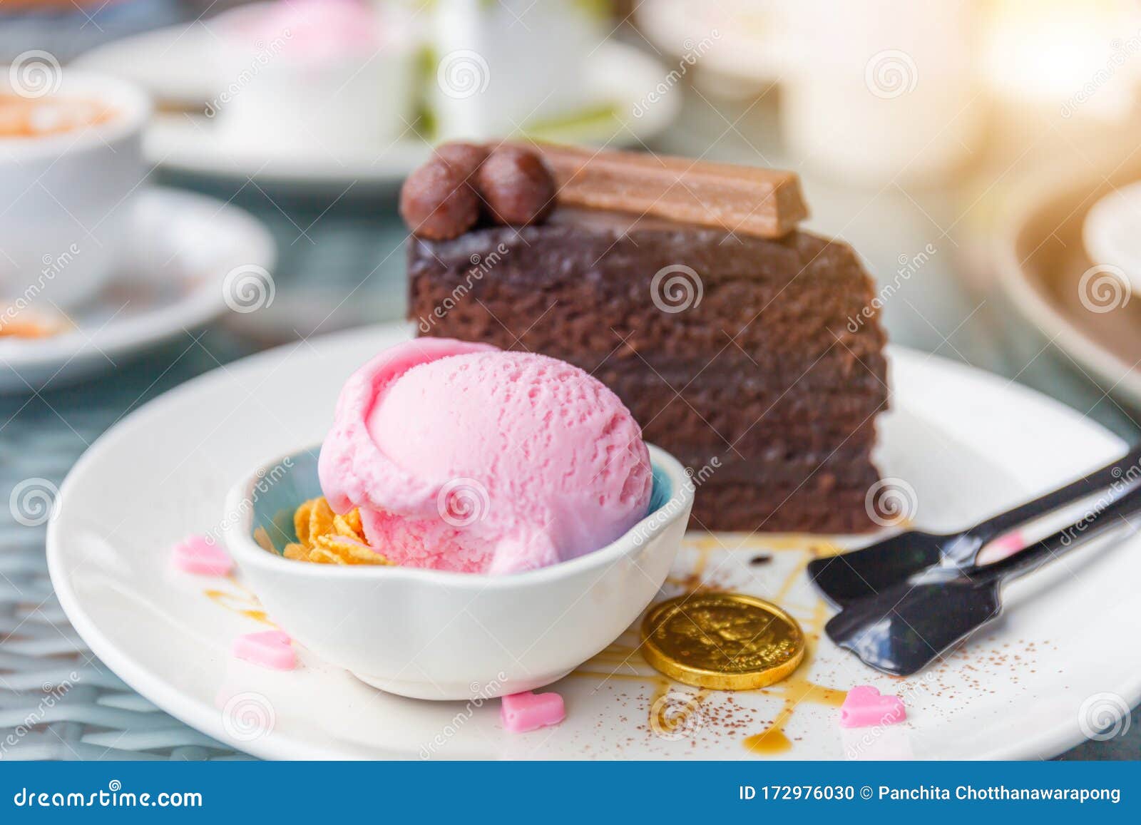 Strawberry Ice Cream Scoop and Chocolate Cake with Blurred Background