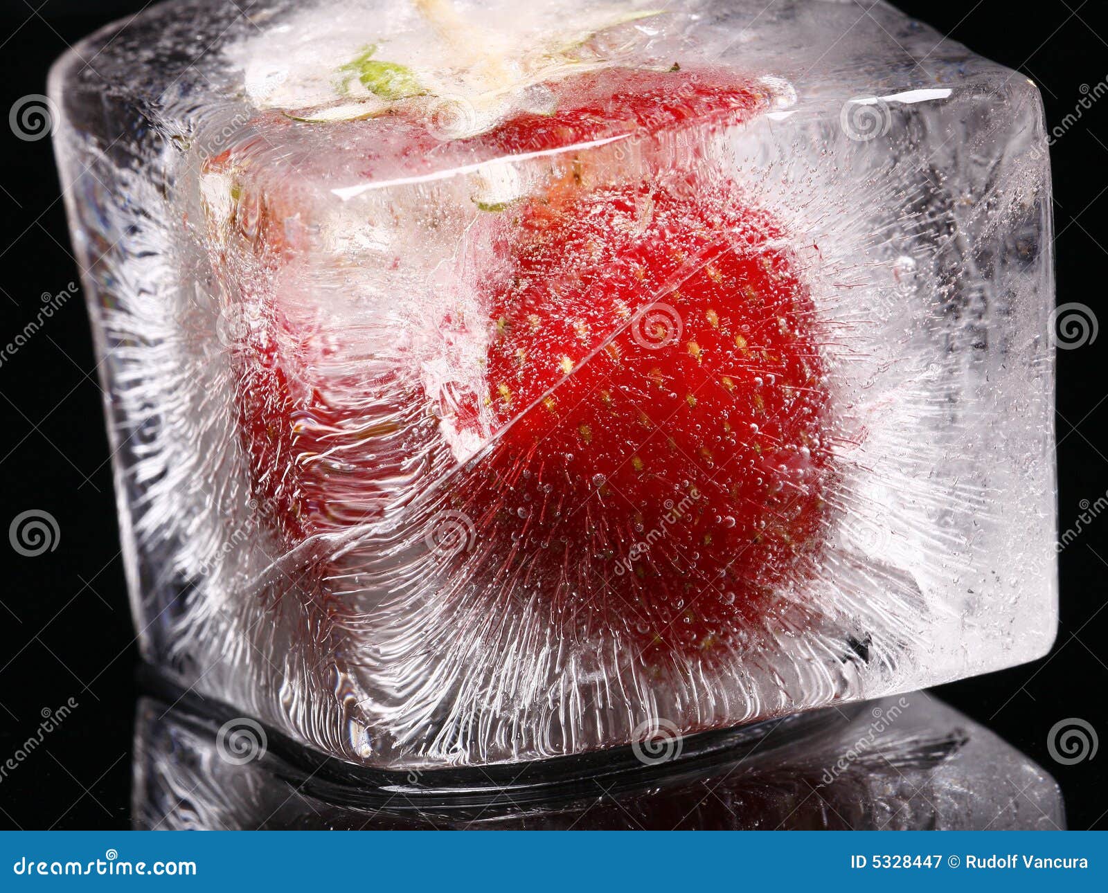 Strawberry in ice cube stock image. Image of still, life