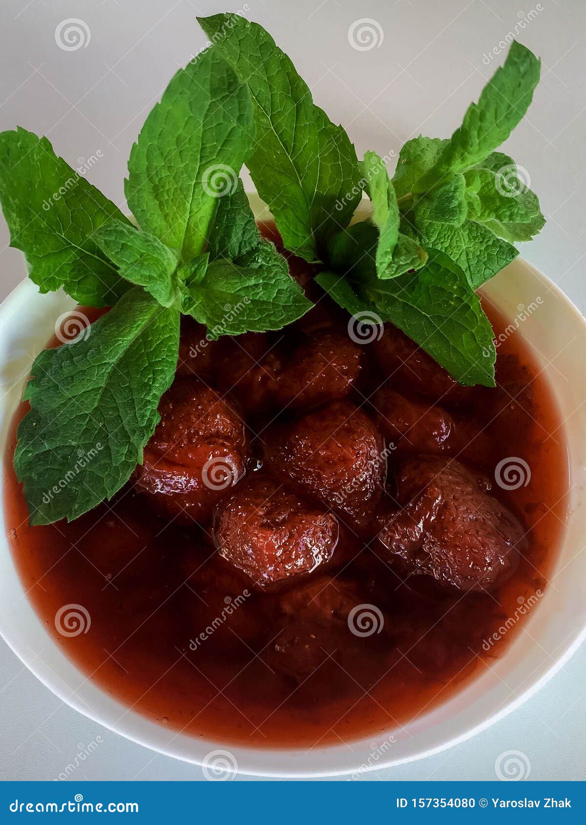 Strawberry Jam and Fresh Mint on a Plate. Stock Photo Image of
