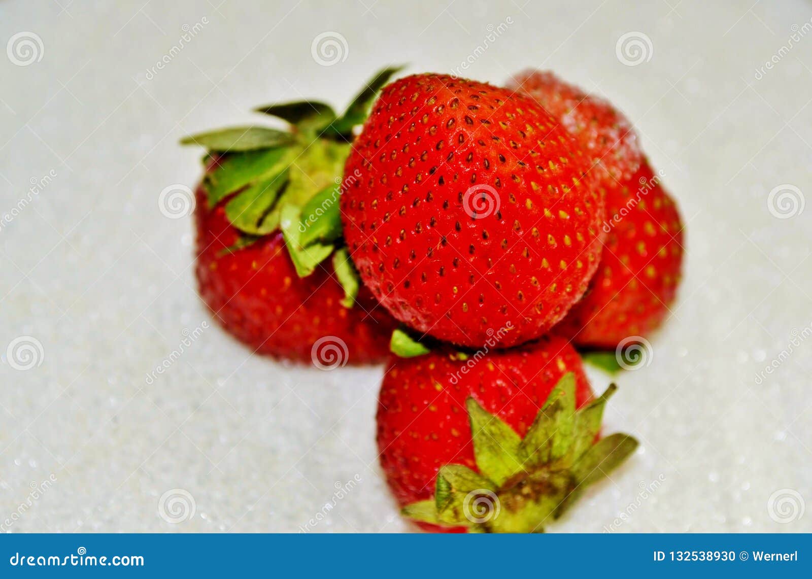 Strawberry on sugar stock photo. Image of green, white 132538930