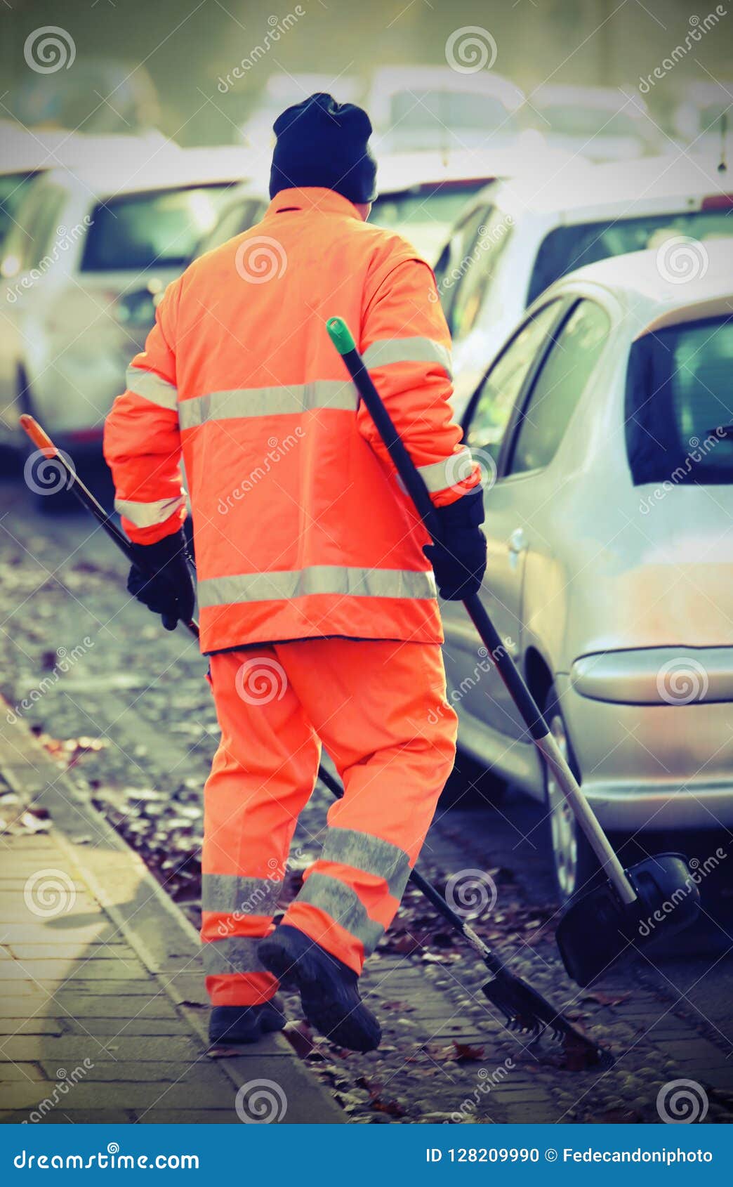 street cleaner with a protective jacket that cleans with vintage