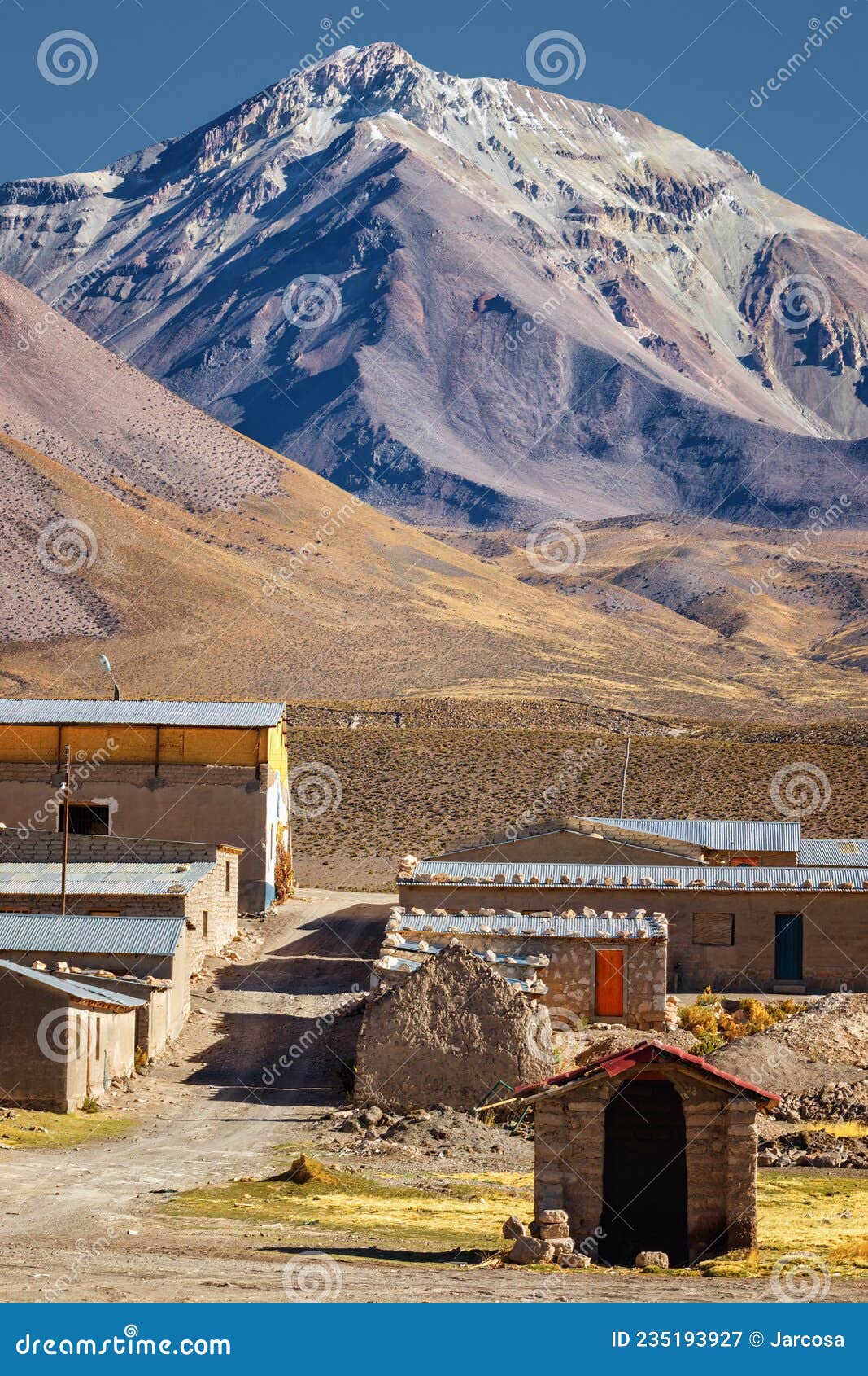 street of the commune of colchane, in the tarapaca region, in the background cerro carabaya, chile