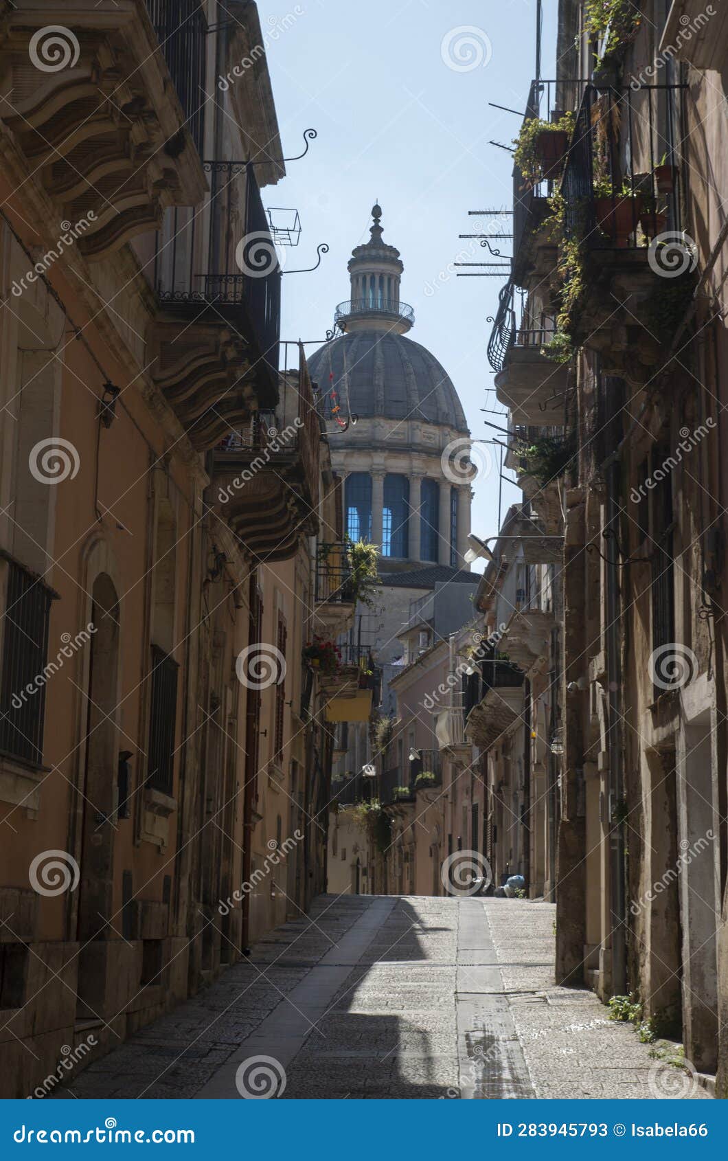 street and dome of san giorgio baroque city ragusa ibla, sicilia, italy