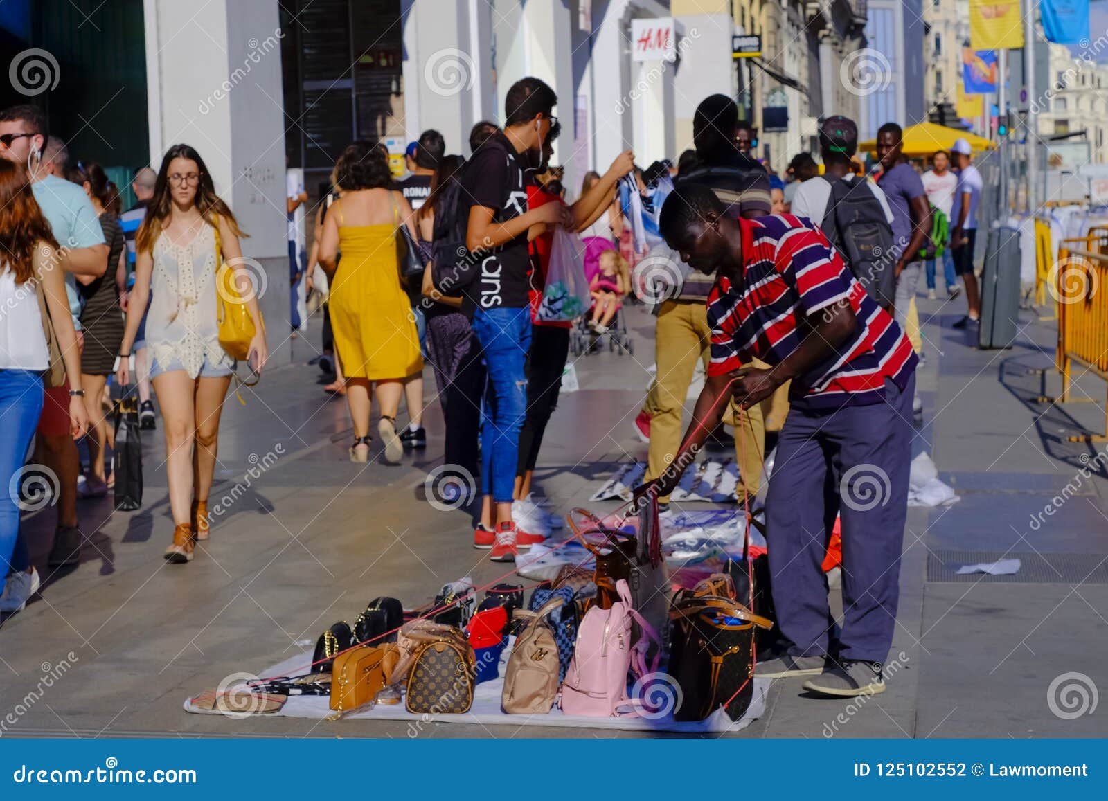 Street Hawker Selling Fake Handbags In Gran Via Madrid Editorial Photography - Image of centre ...