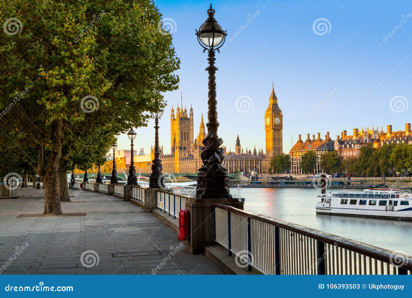 street lamp on south bank of river thames with big ben and palace of westminster in background, london, england, uk