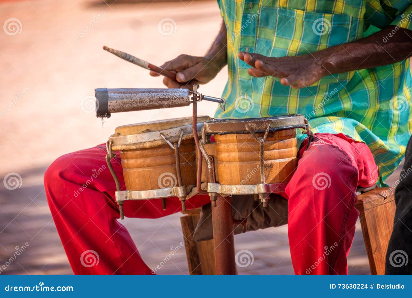 street musician playing drums in trinidad cuba